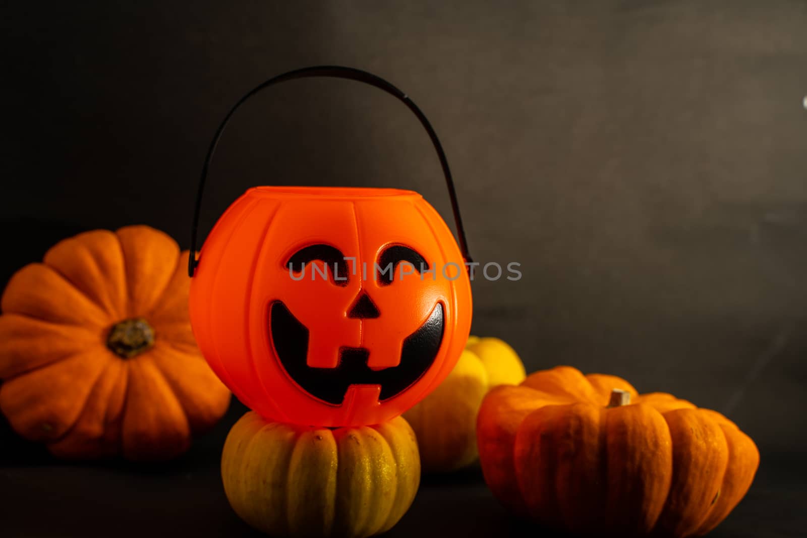 Halloween pumpkin on dark background with space for text by peerapixs