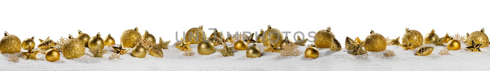 Christmas border with golden ornaments on snow isolated on white background