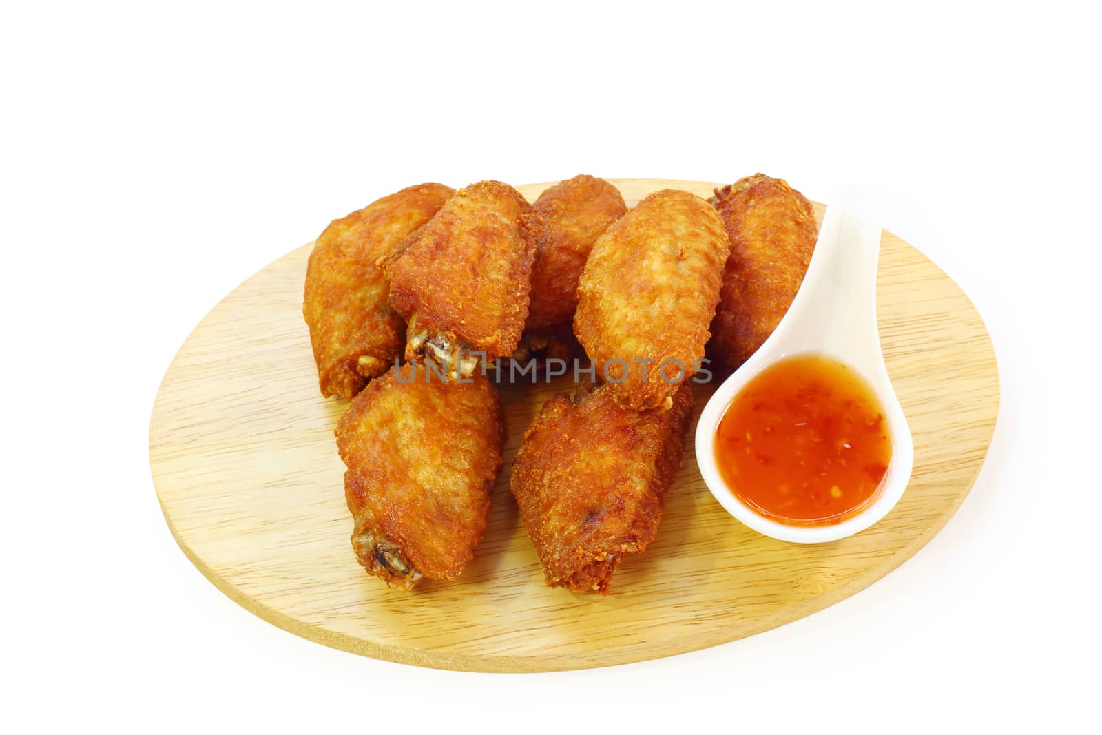 Fried chicken wings with sauce isolated on white background, clipping path.