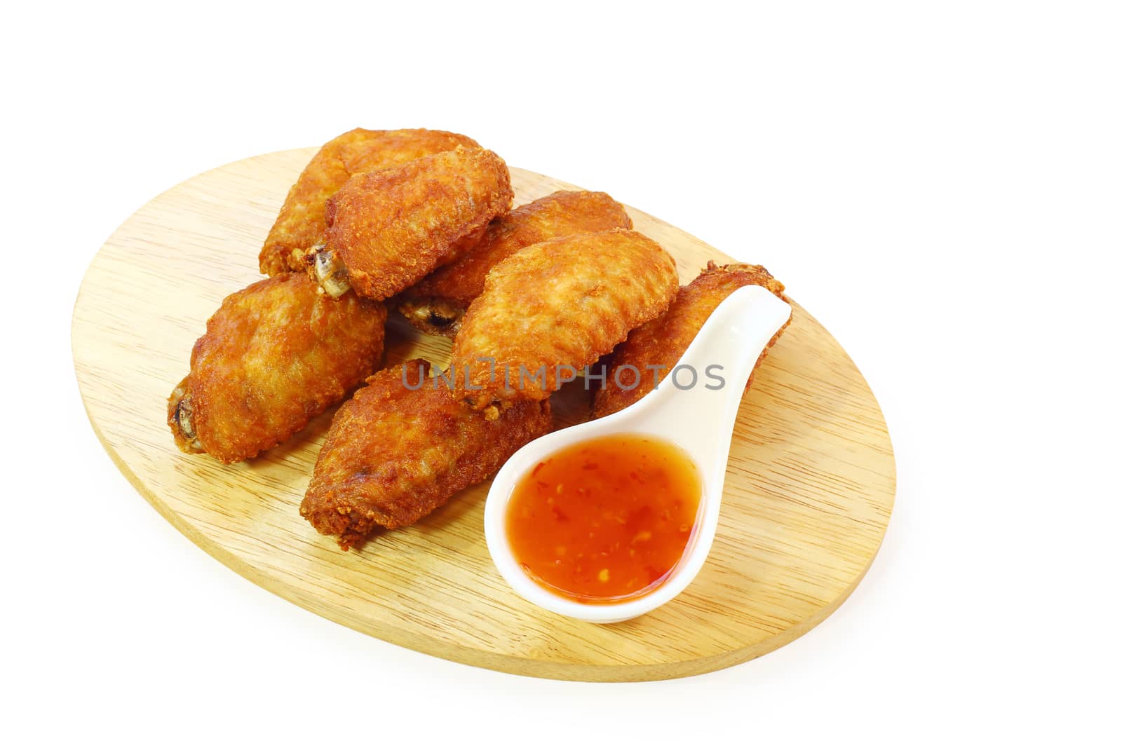 Fried chicken wings with sauce isolated on white background, clipping path.
