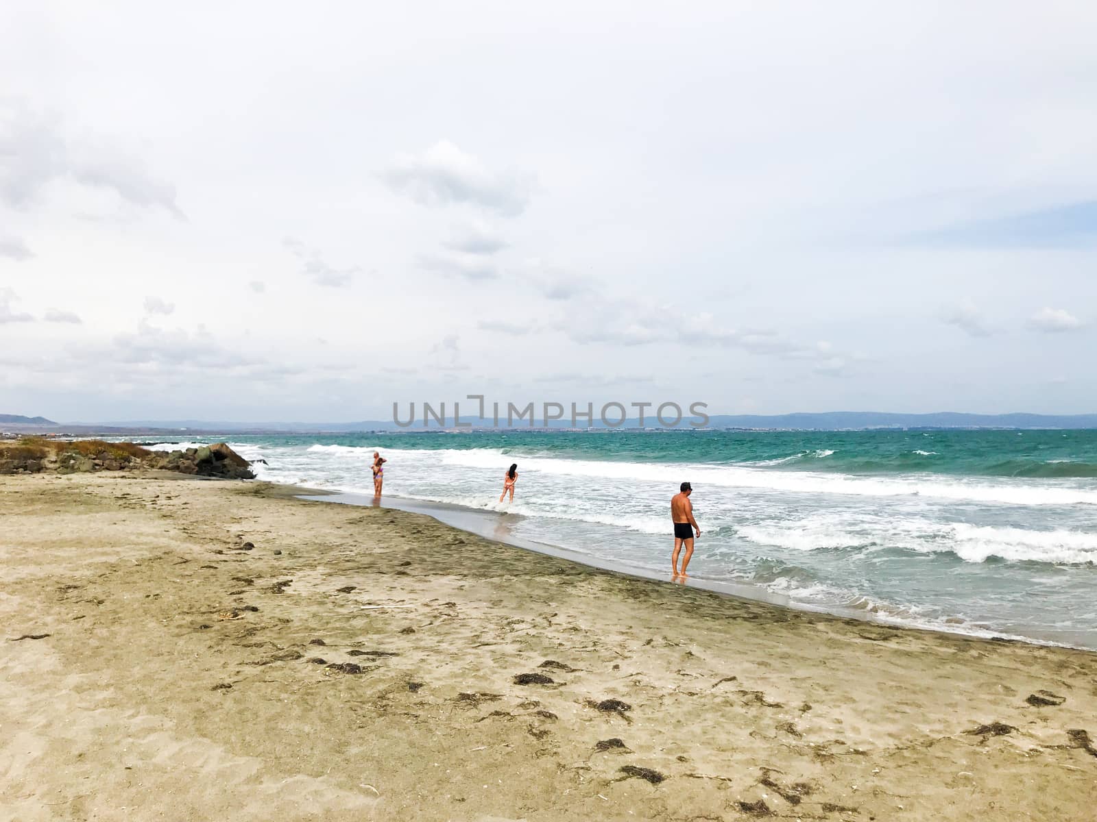 Pomorie, Bulgaria - September 12, 2019: People Relaxing On The Beach. by nenovbrothers