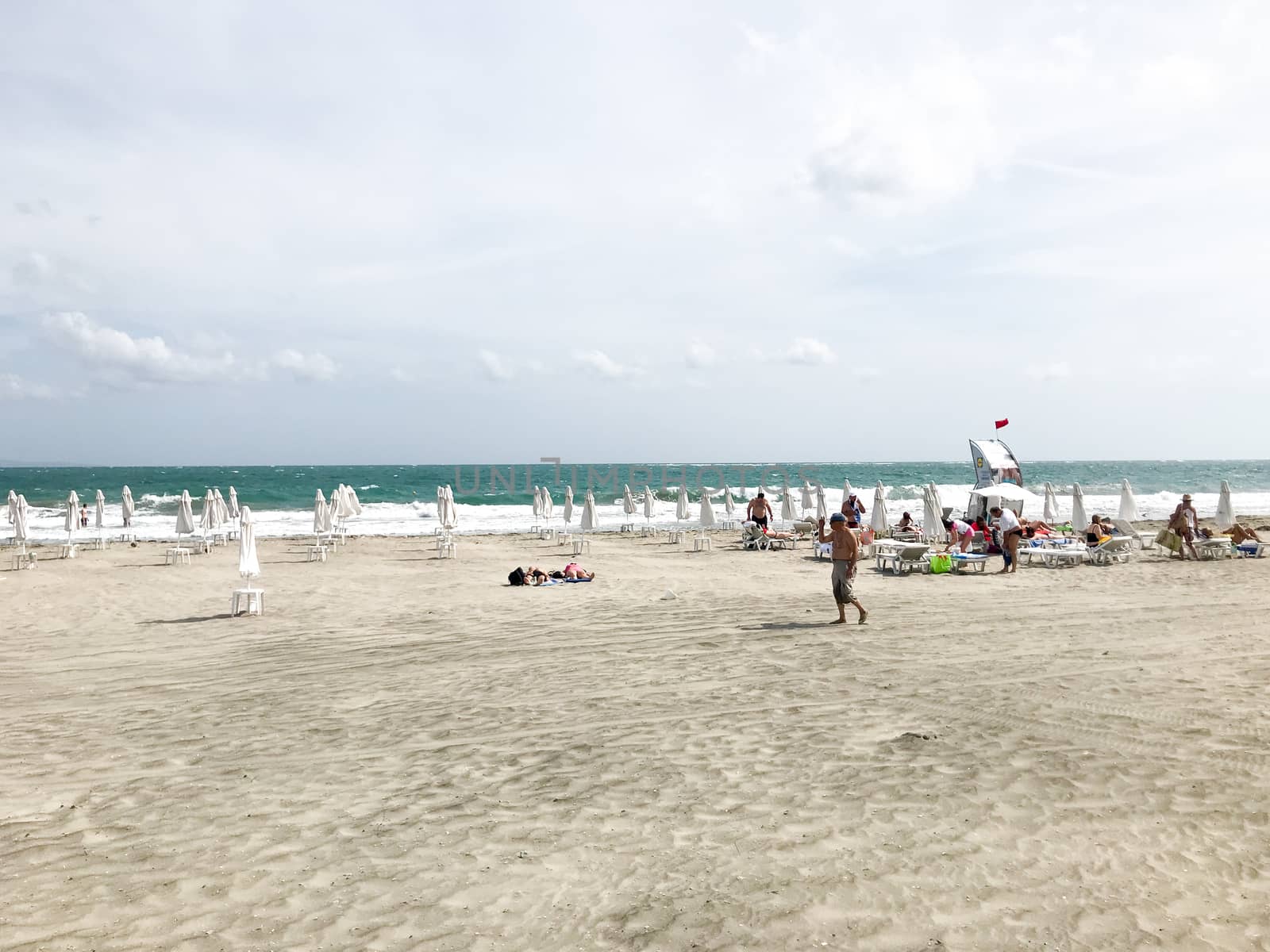 Pomorie, Bulgaria - September 12, 2019: People Relaxing On The Beach.
