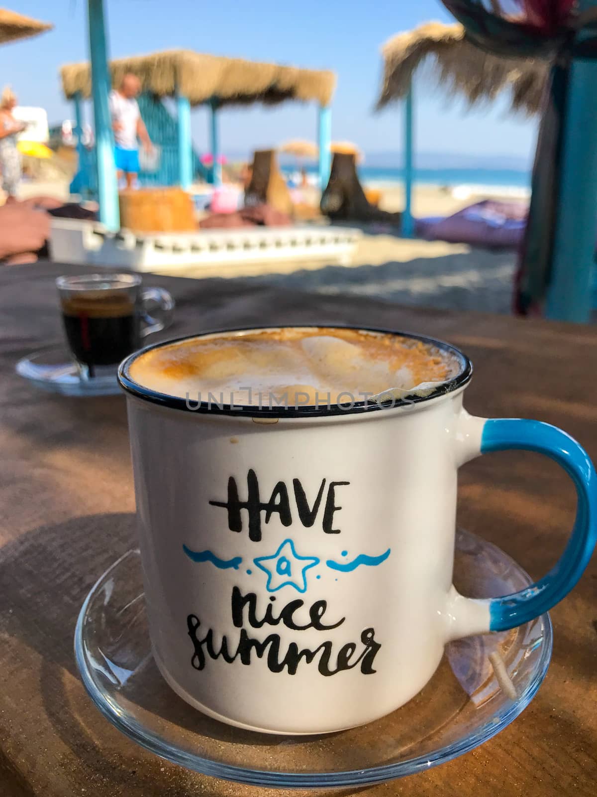 Pomorie, Bulgaria - September 12, 2019: Warm Cappuccino On The Beach. by nenovbrothers