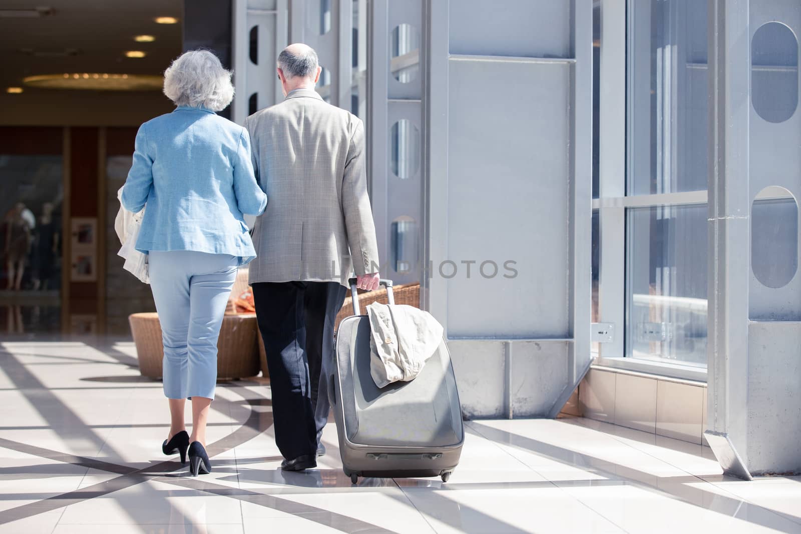 Senior couple in airport by ALotOfPeople