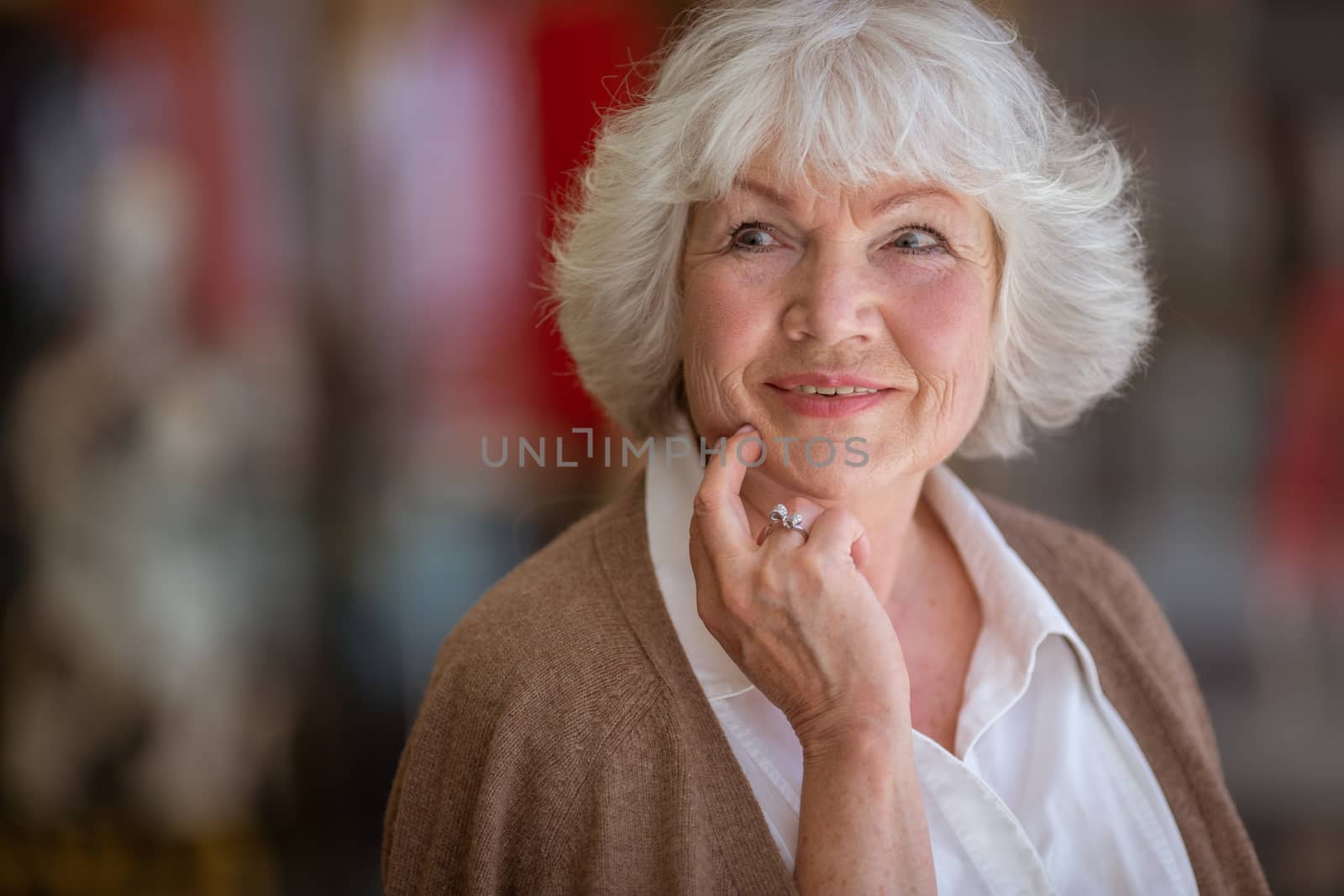 Portrait of beautiful senior woman in a shopping center