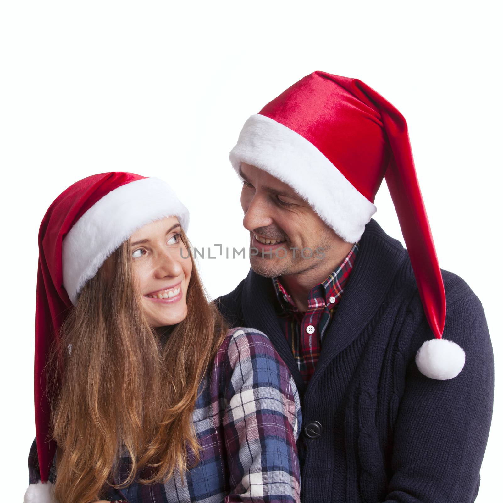 Couple in Santa hats by ALotOfPeople