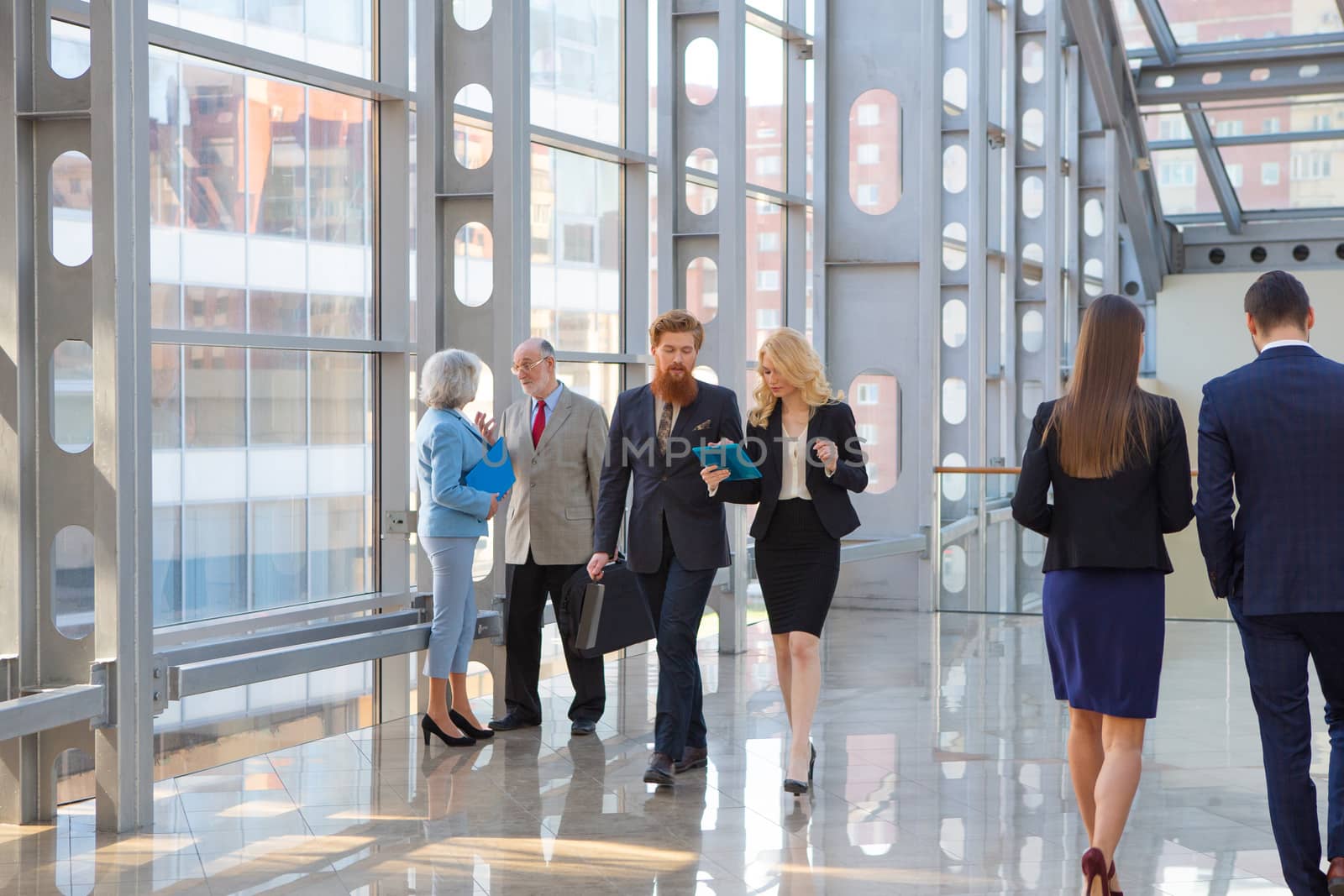 Business people walking in the lobby of a modern business center