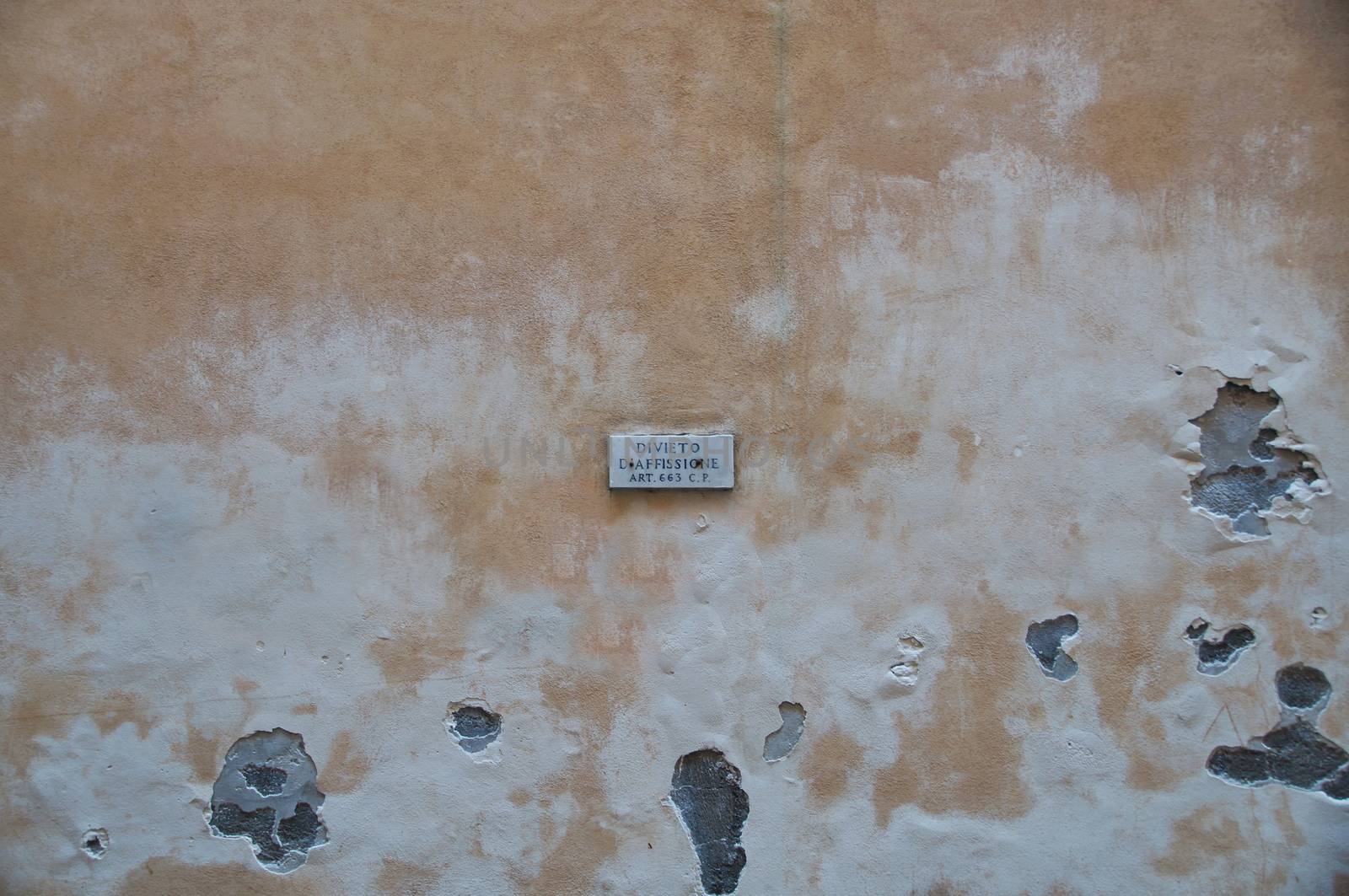 Street sign Divieto D'Affissione on the wall of a house in the center of Rome, Italy