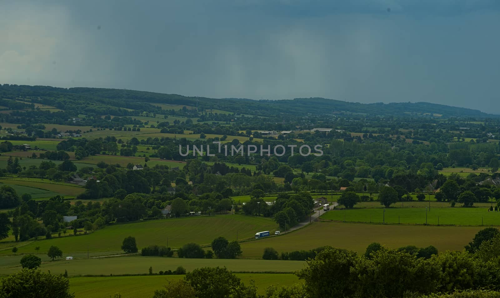 View from the hill on landscape in rural Normandy and storm forming in the distance