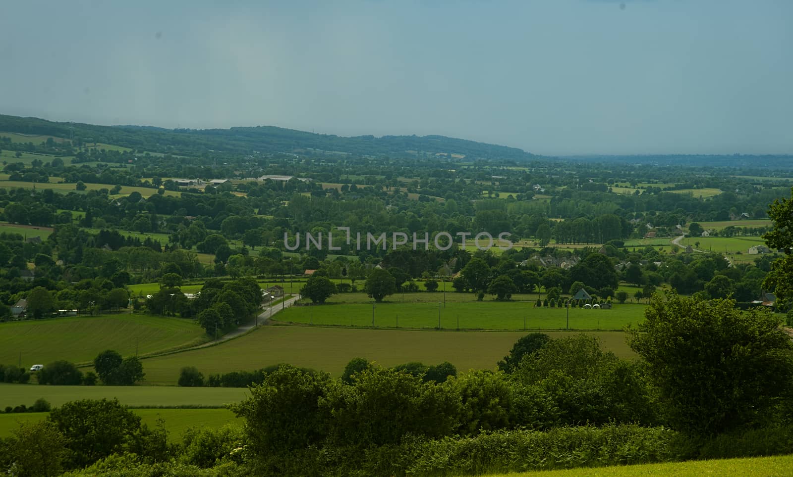 View from the hill on landscape in rural Normandy and storm forming in the distance