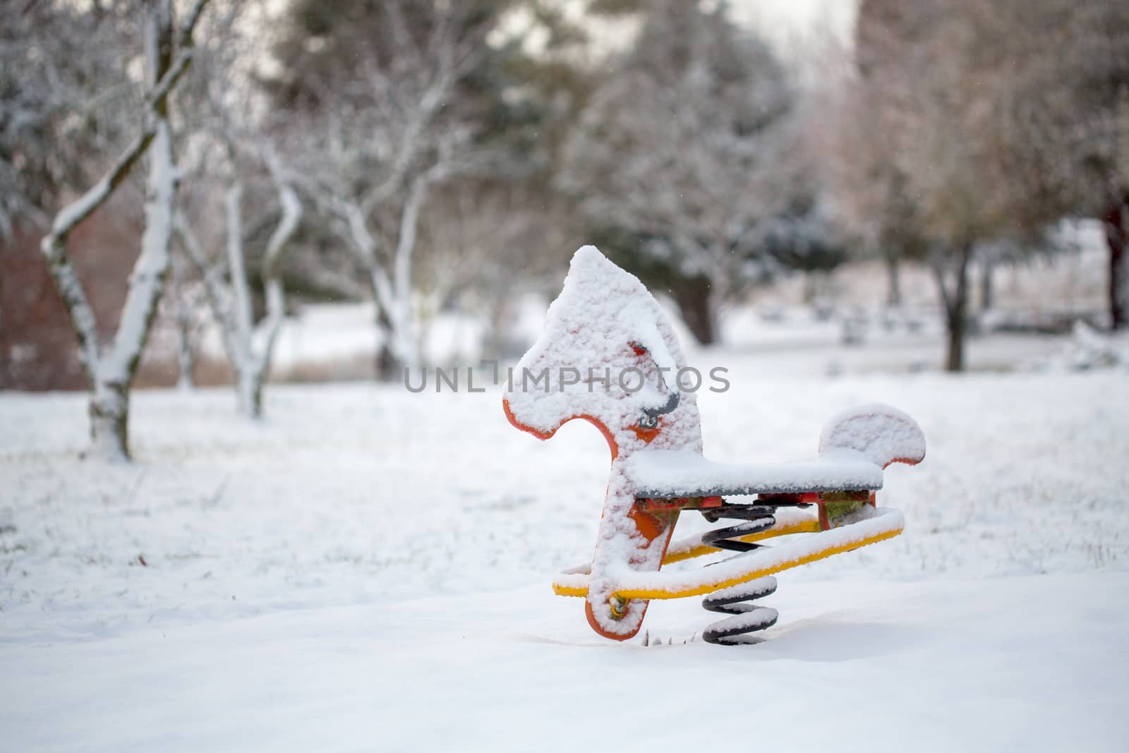 A childs playground toy covered in snow in outdoor park in Oberon Australia