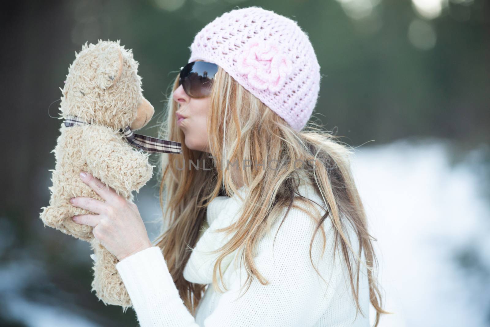 Girl blowing kisses to scruffy teddy bear by lovleah