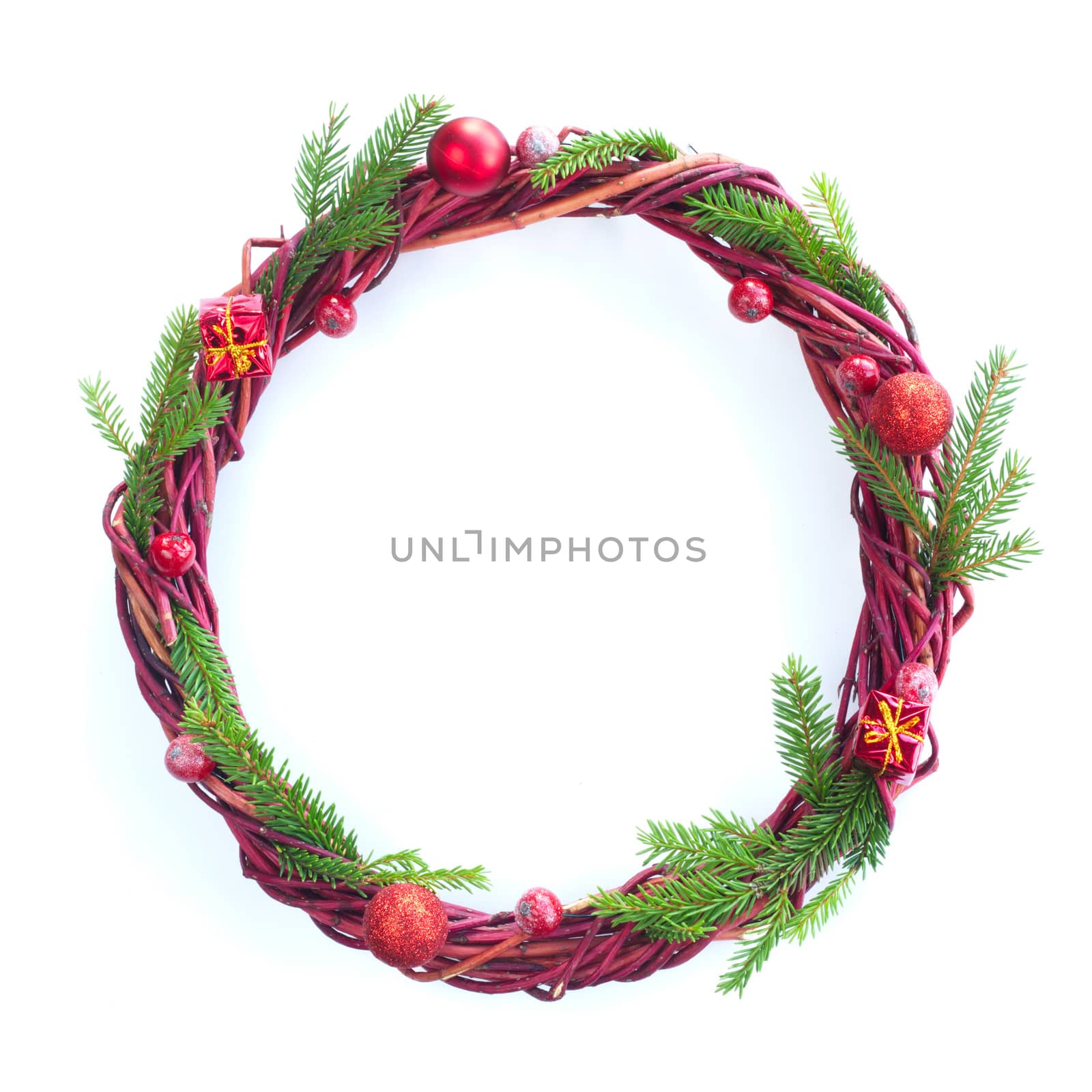 Christmas wreath of fir tree branches and red berries isolated on white background copy space for text border frame for text