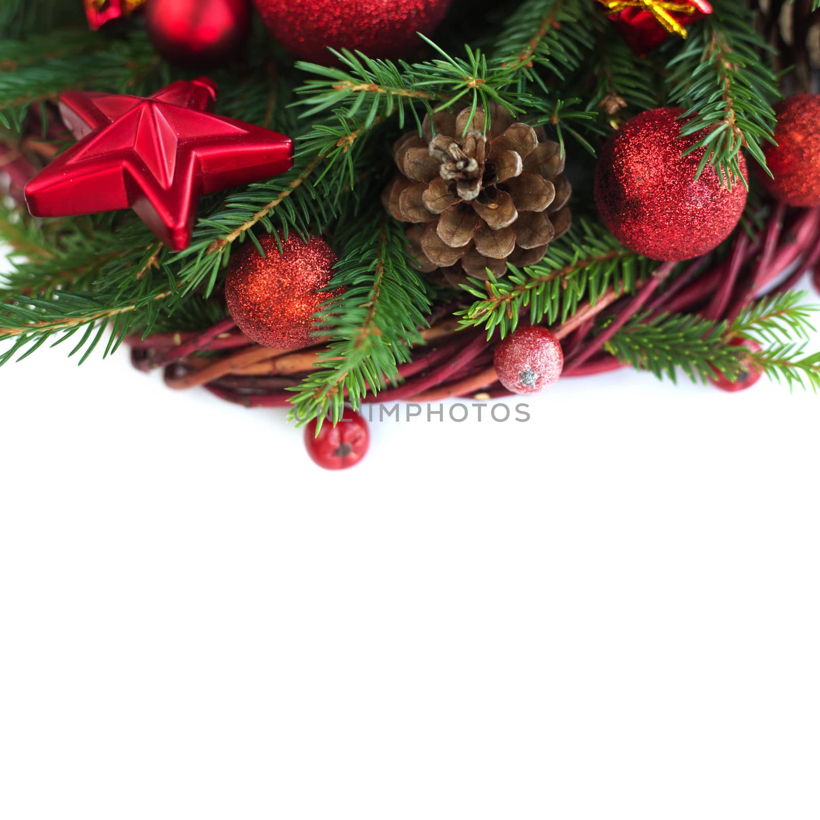 Christmas wreath of fir tree branches decorative beaubles and red berries isolated on white background copy space for text