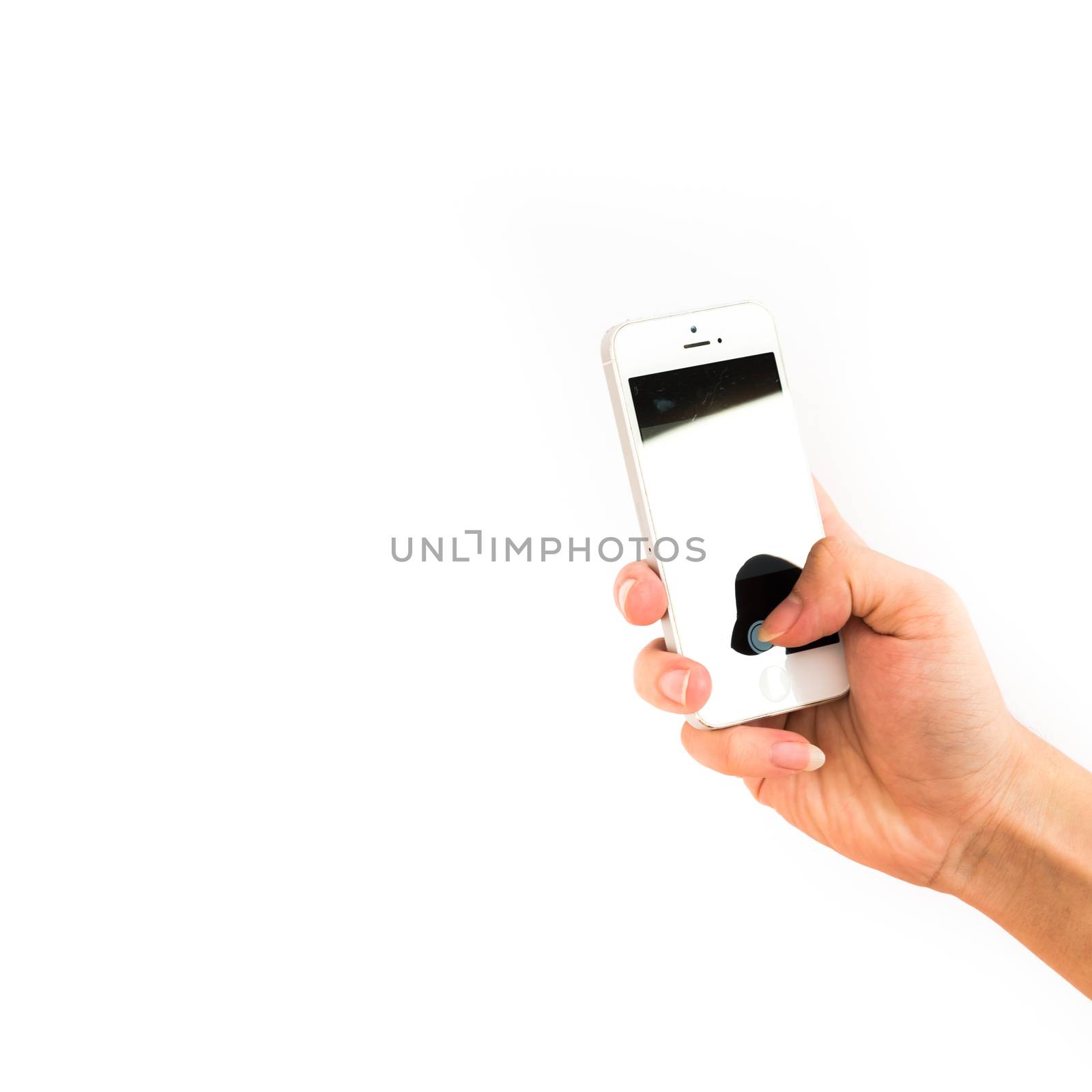 Studio shot of Asian man hand holding vertical white Smartphone with blank screen isolated on white background. Close-up finger taking photo on mobile phone concept with clipping path copy space