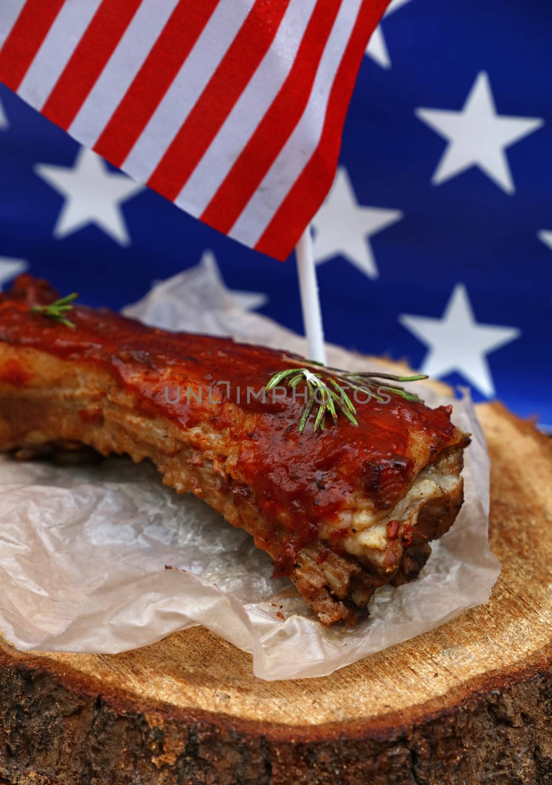 Pork spare ribs in bbq sauce over American flag by BreakingTheWalls