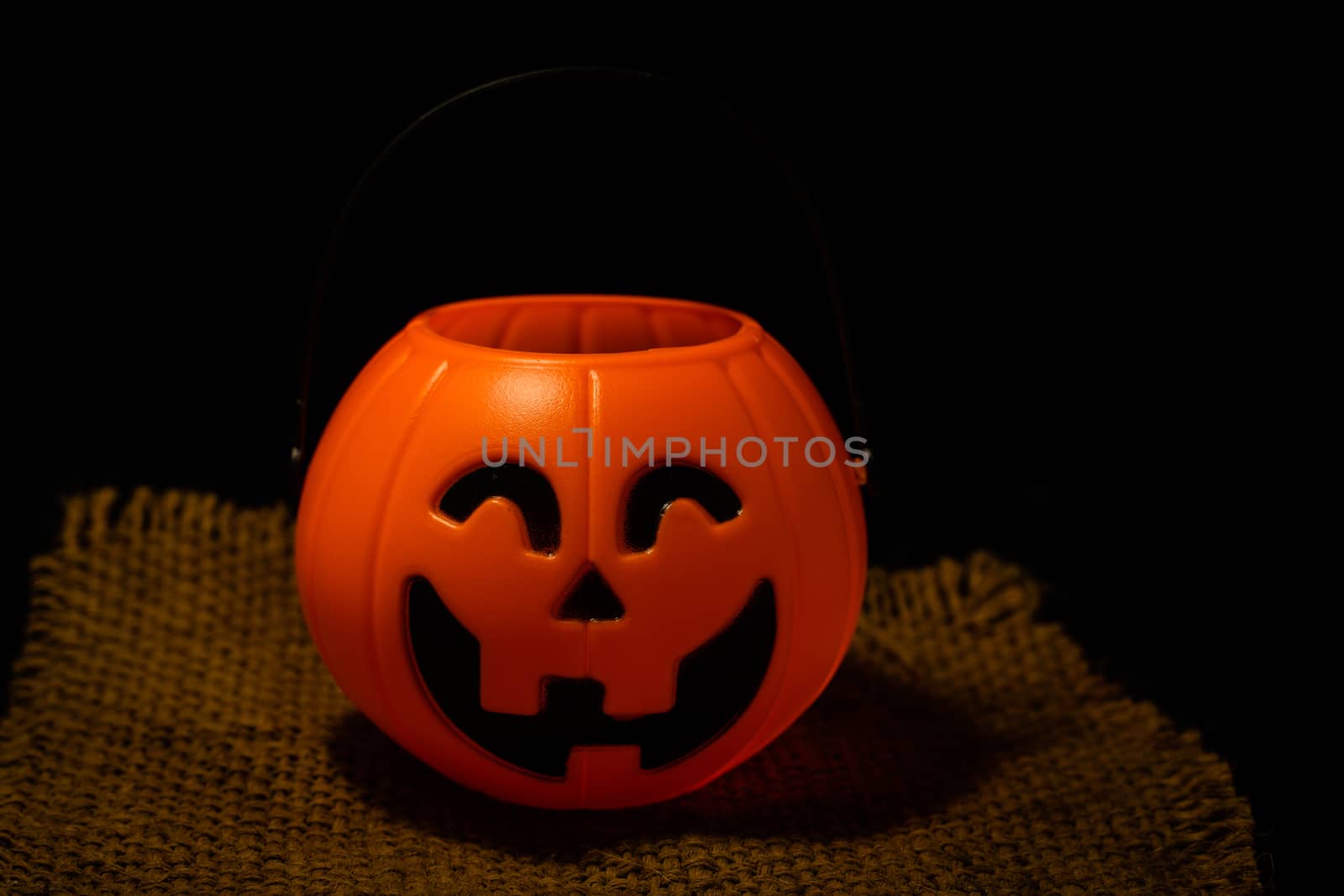 Halloween pumpkin on dark background with space for text by peerapixs