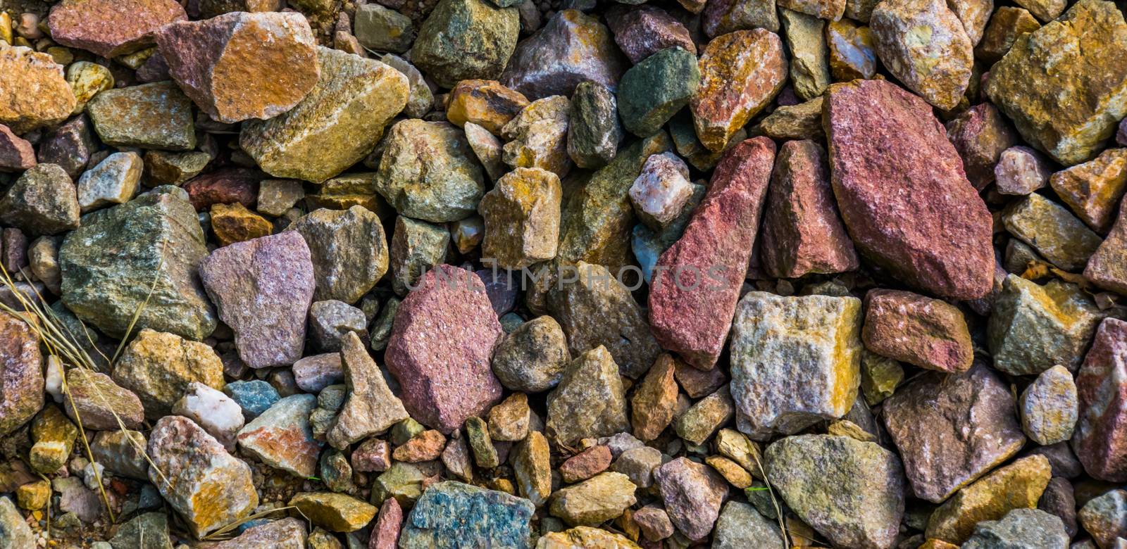 gravel stones in diverse colors in closeup, stone pattern background