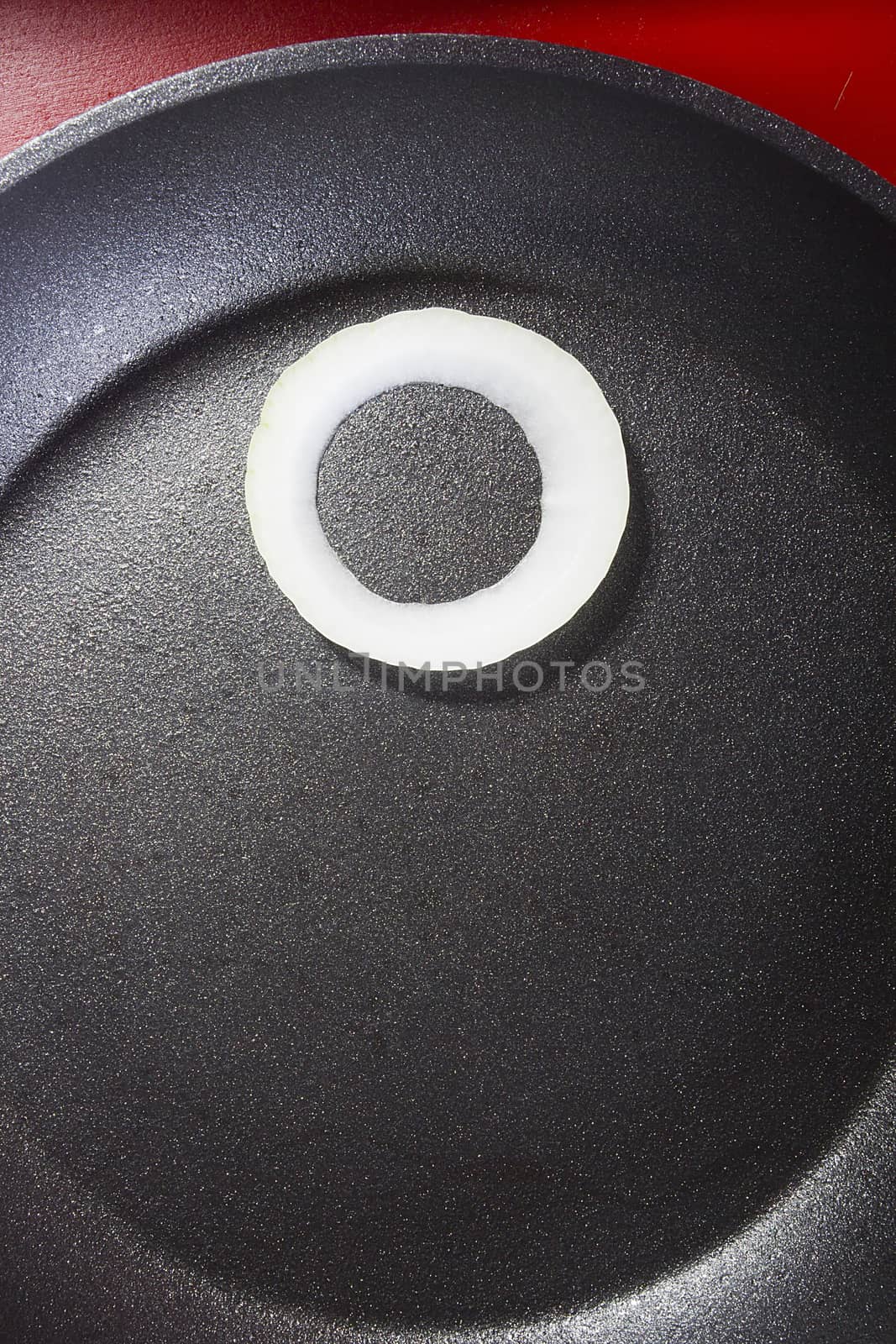 Onion ring on the surface of the pan