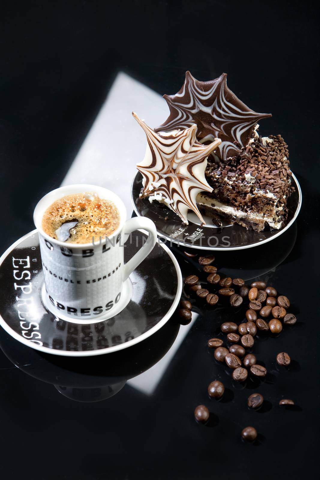 Coffee and chocolate cake on a glass