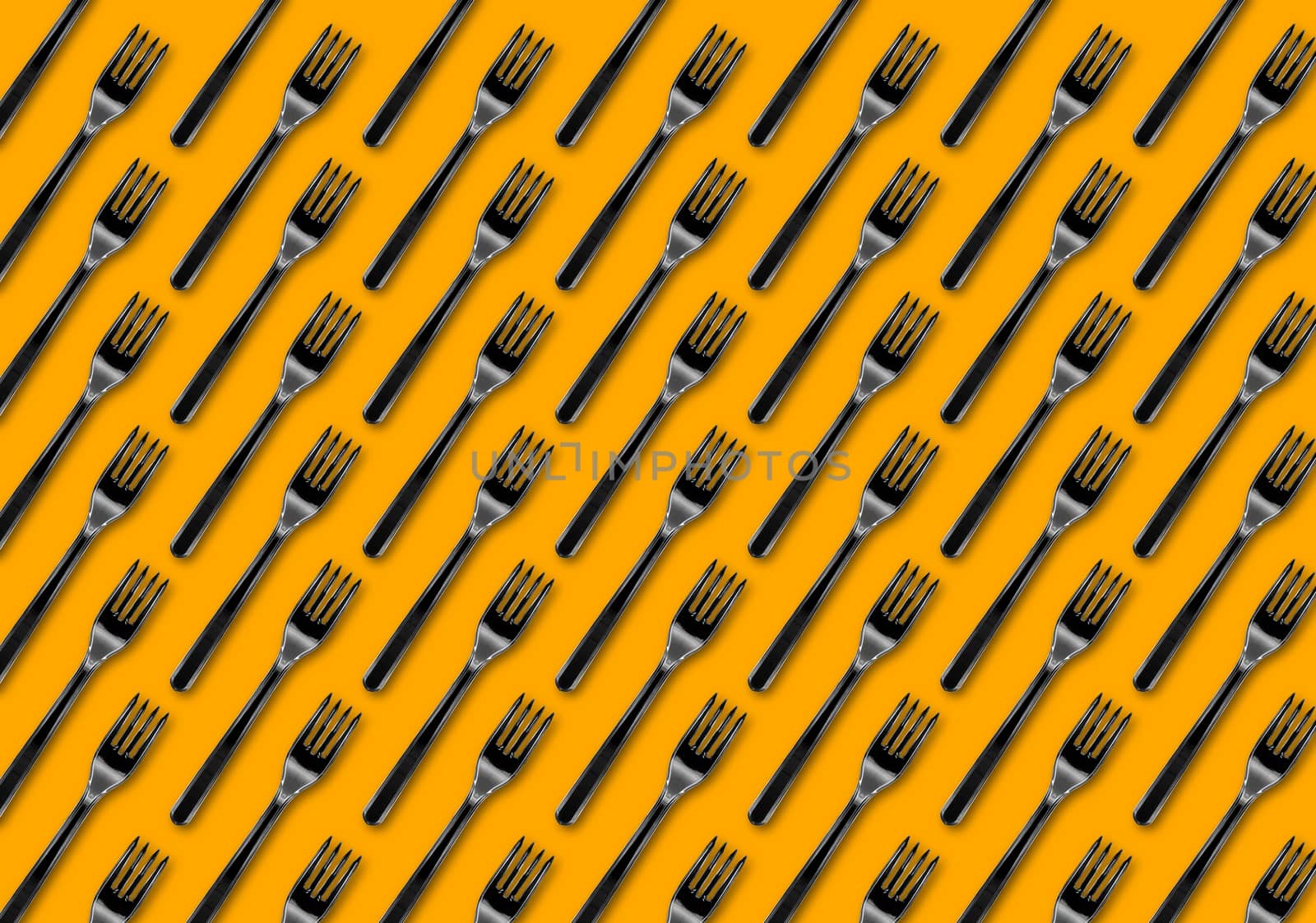 Many black plastic forks on yellow background, top view. Disposable table wear concept. Creative top view pattern.