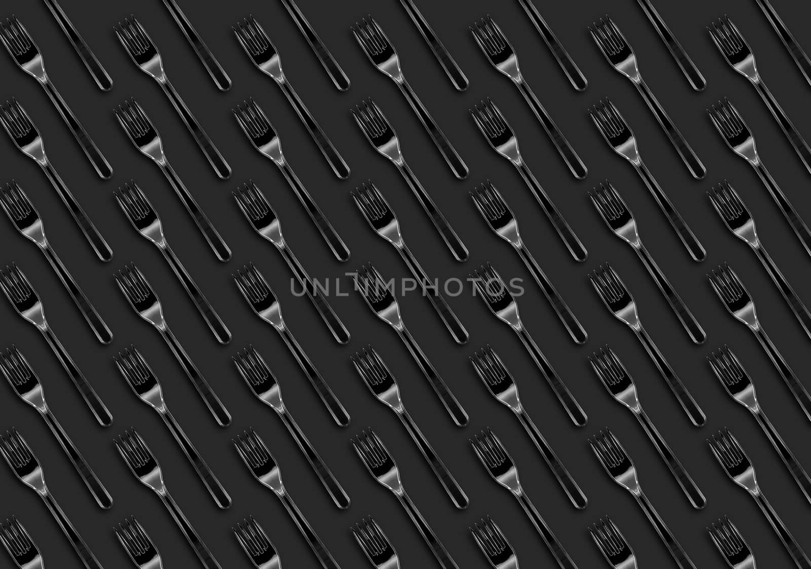 Many transparent plastic forks  on gray background, top view. Disposable table wear concept. Creative top view pattern.