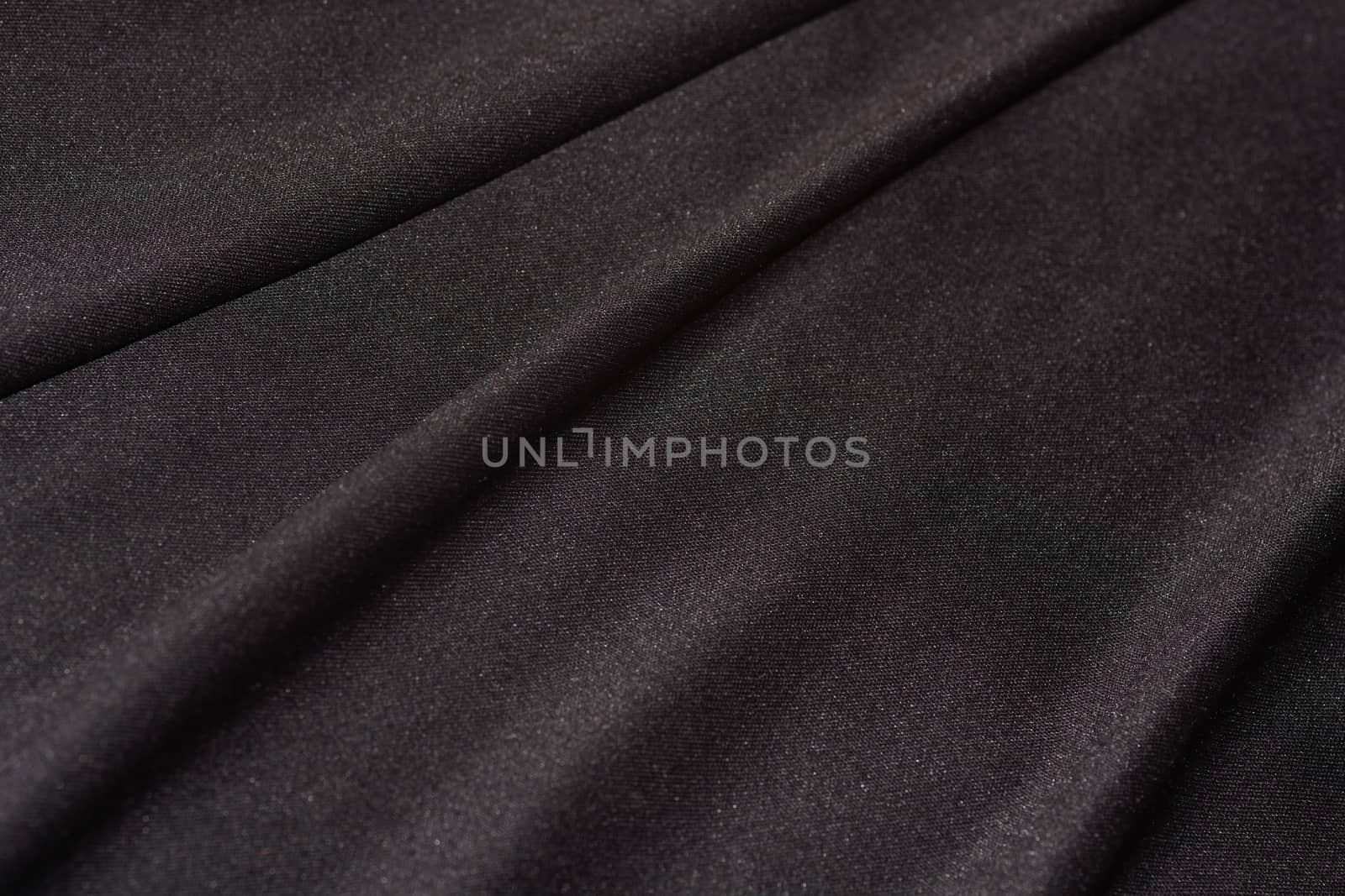 Black Satin Textile Fabric Folds Close-up by jjvanginkel