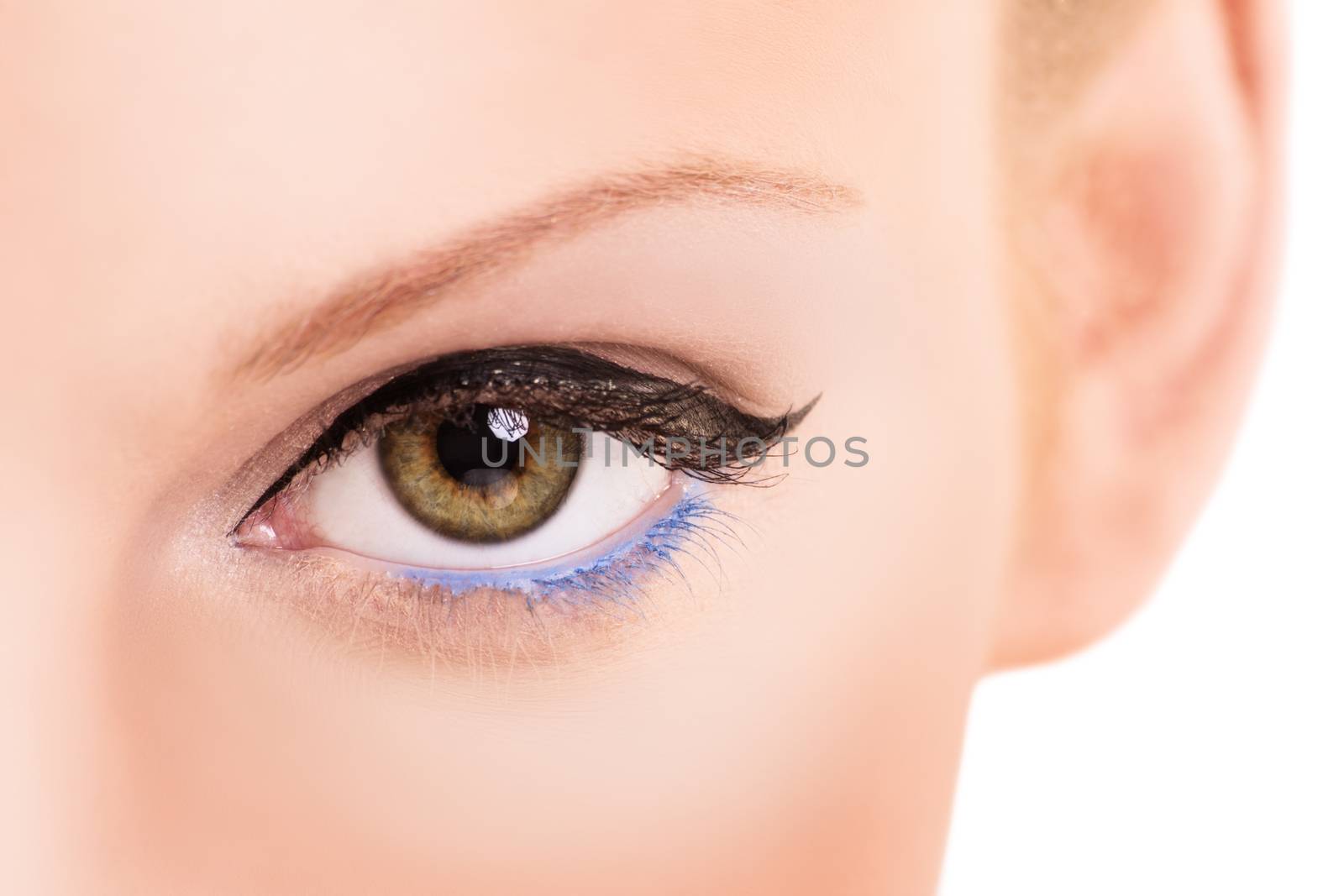 A close up shot of a female eye with clean make up, isolated on white background.