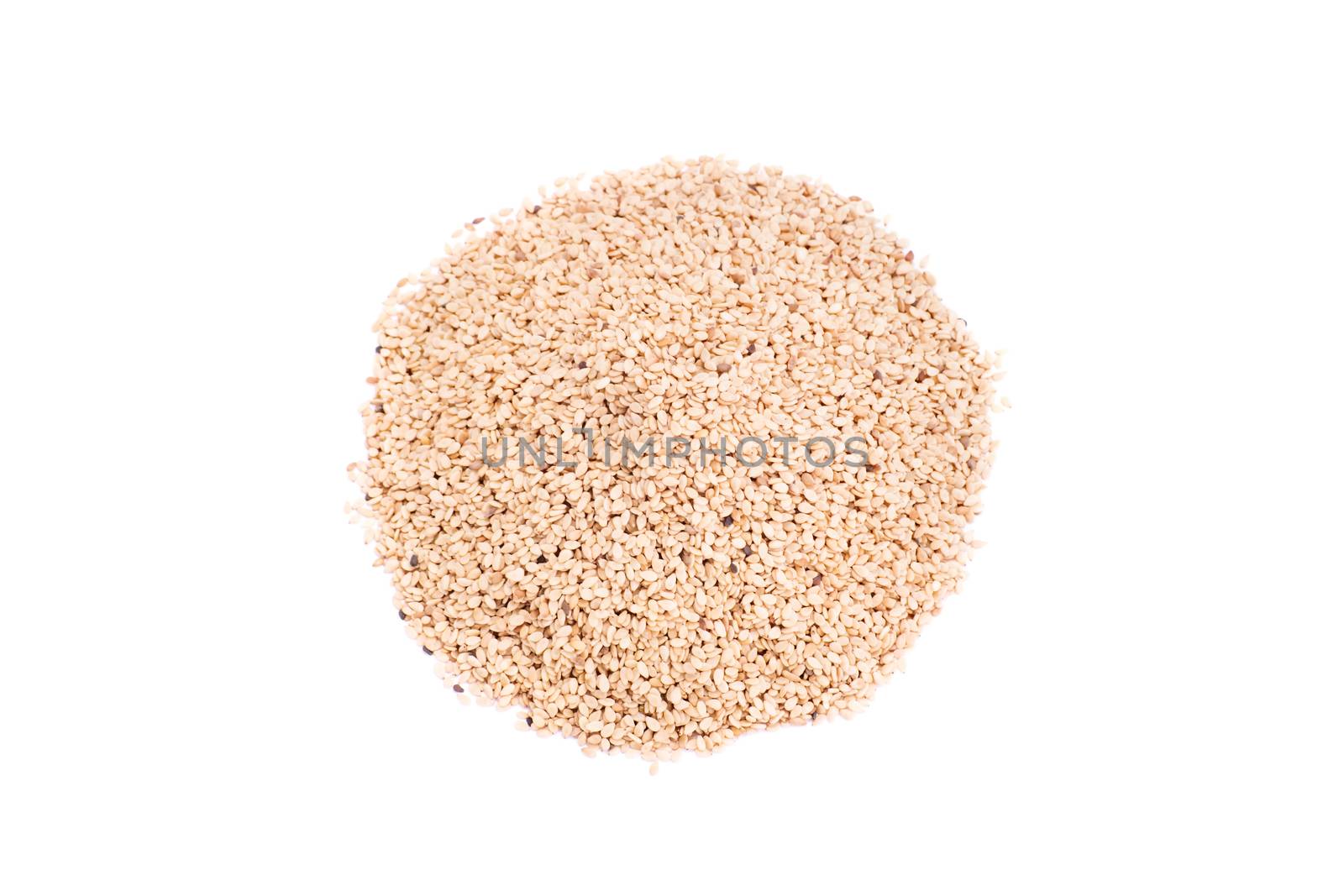 Top perspective of a heap of sesame seeds, isolated on white background.