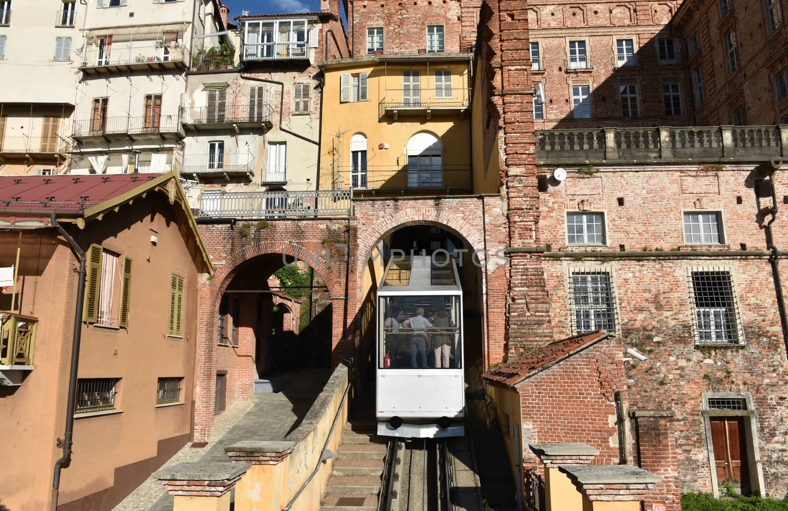 The photo represents old medieval buildings of Mondovi Piazza, with a funicolare