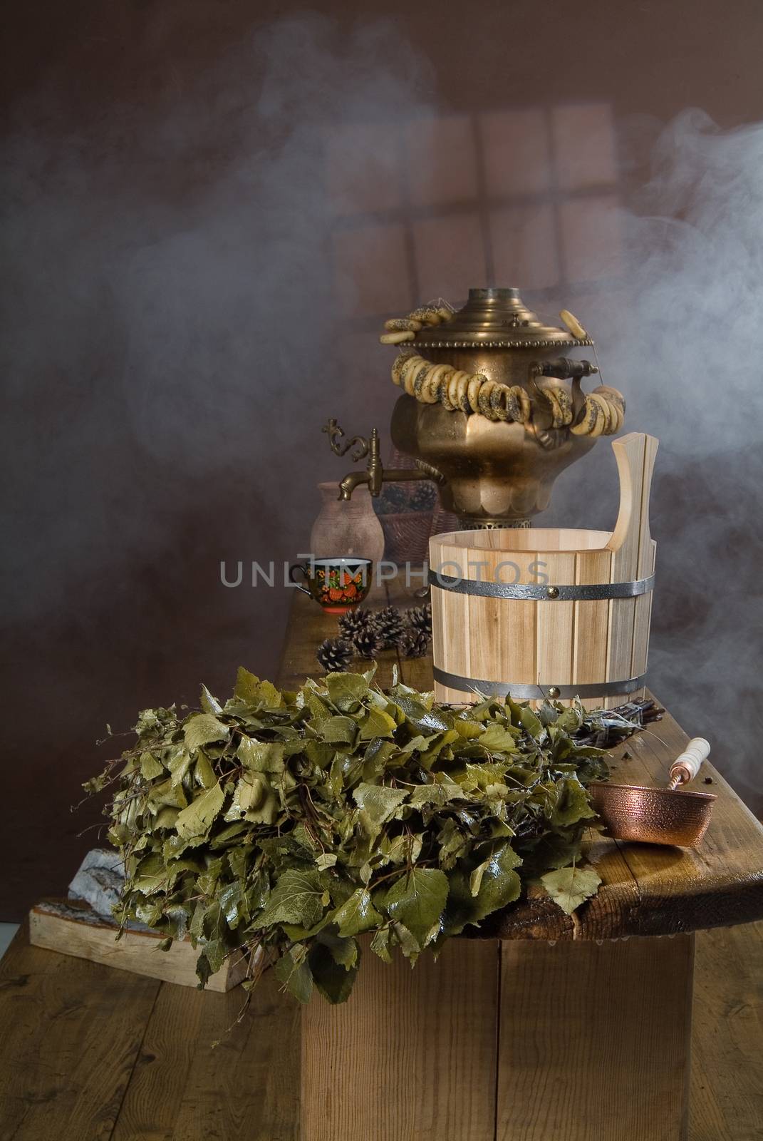 Russian traditional bath accessories on a wooden background