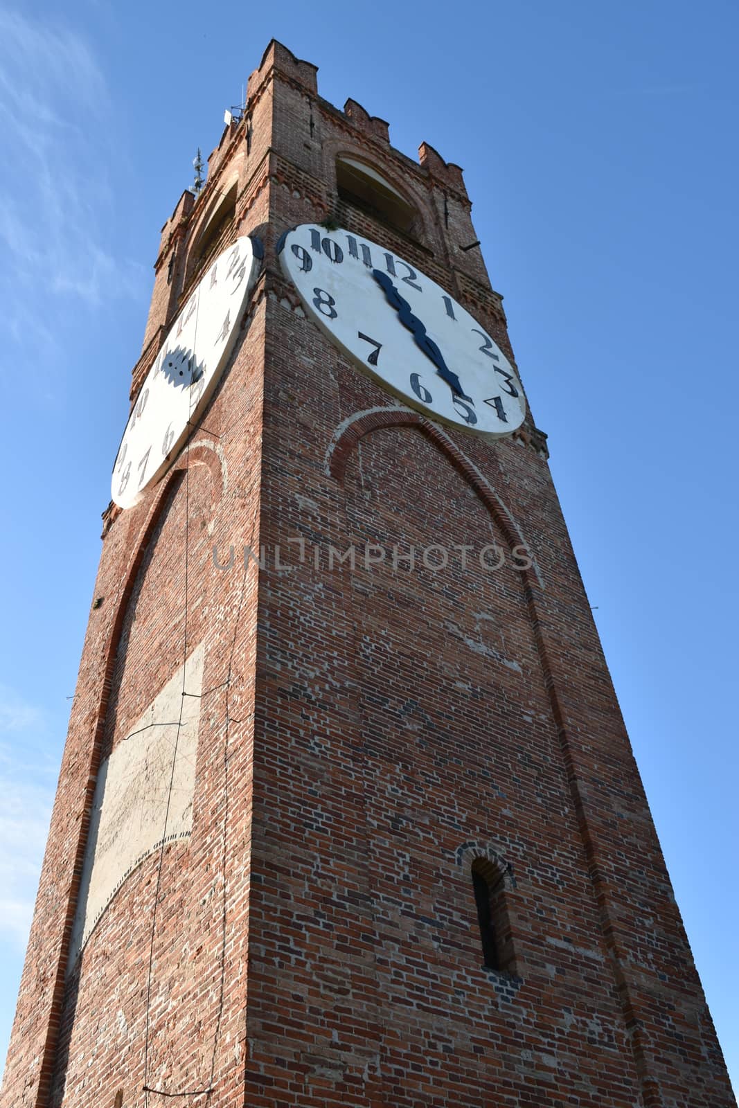 This image represents a view from below of the tower with clock of Mondovi Piazza, Piedmont, Italy