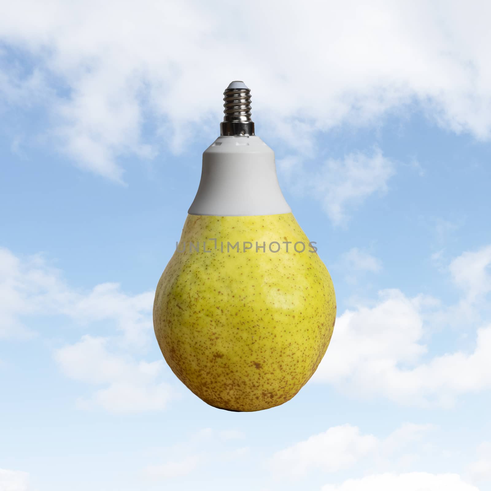 A pear with a light bulb attack with a sky in the background