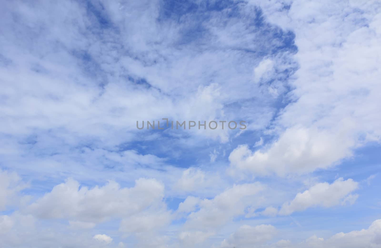 White clouds in blue sky with space for your text