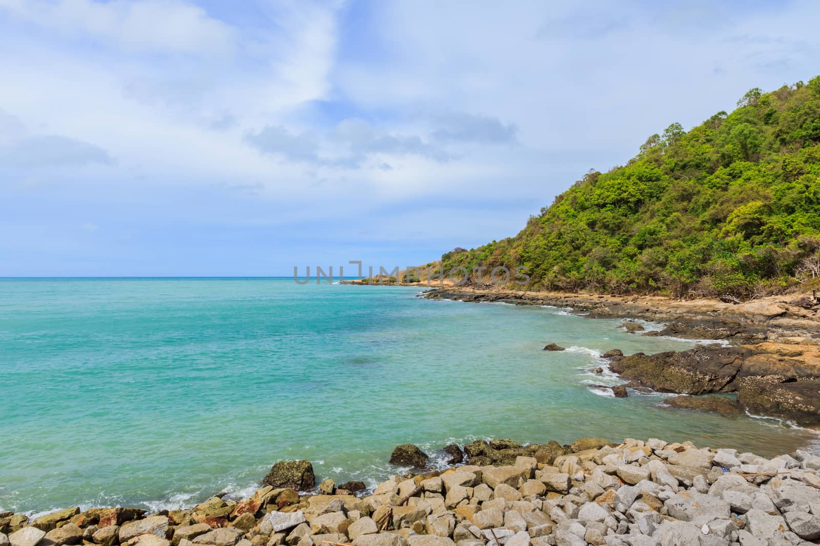 Sky with beautiful beach with rocks and tropical sea in Thailand.