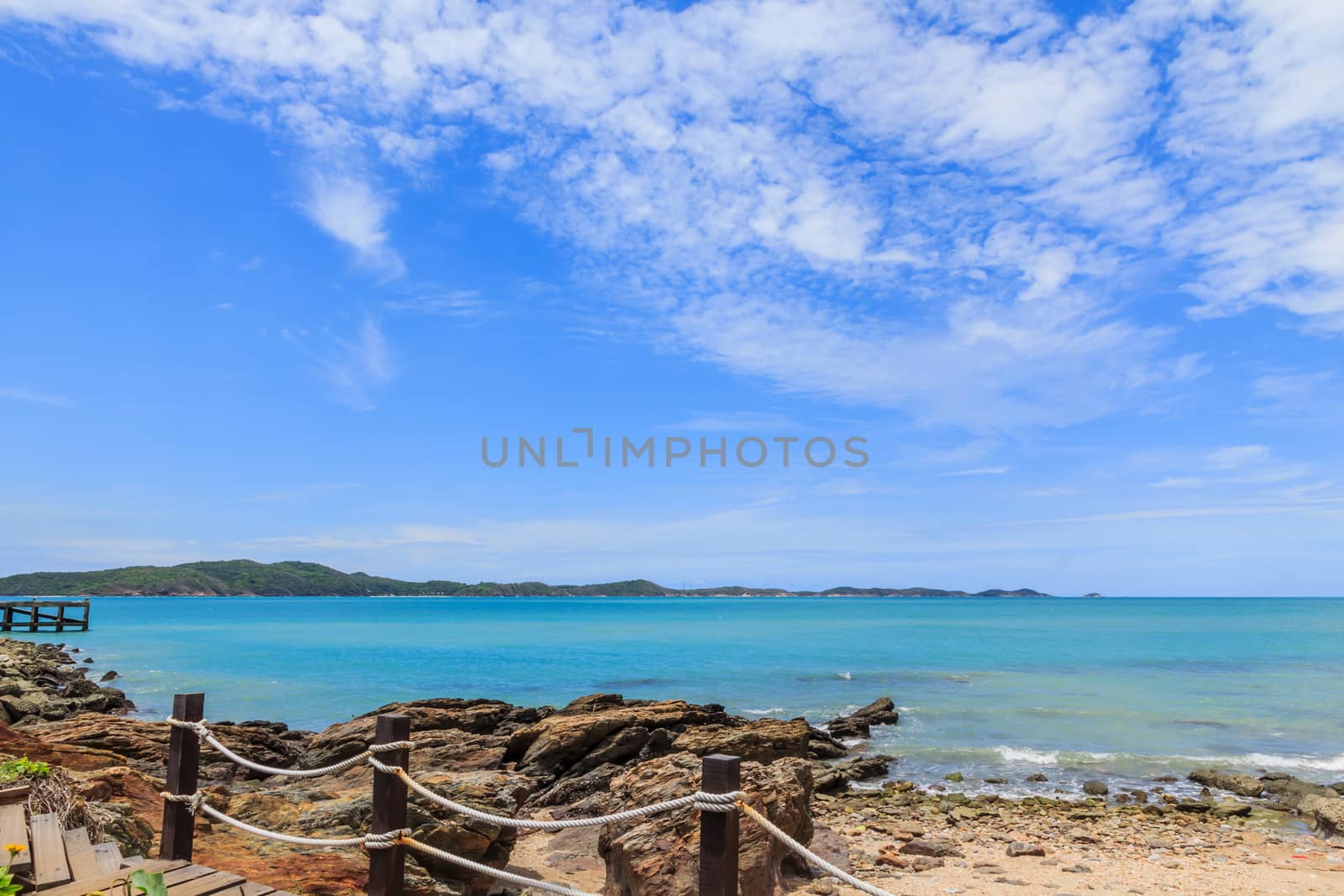 Sky with beautiful beach with rocks and tropical sea in Thailand.