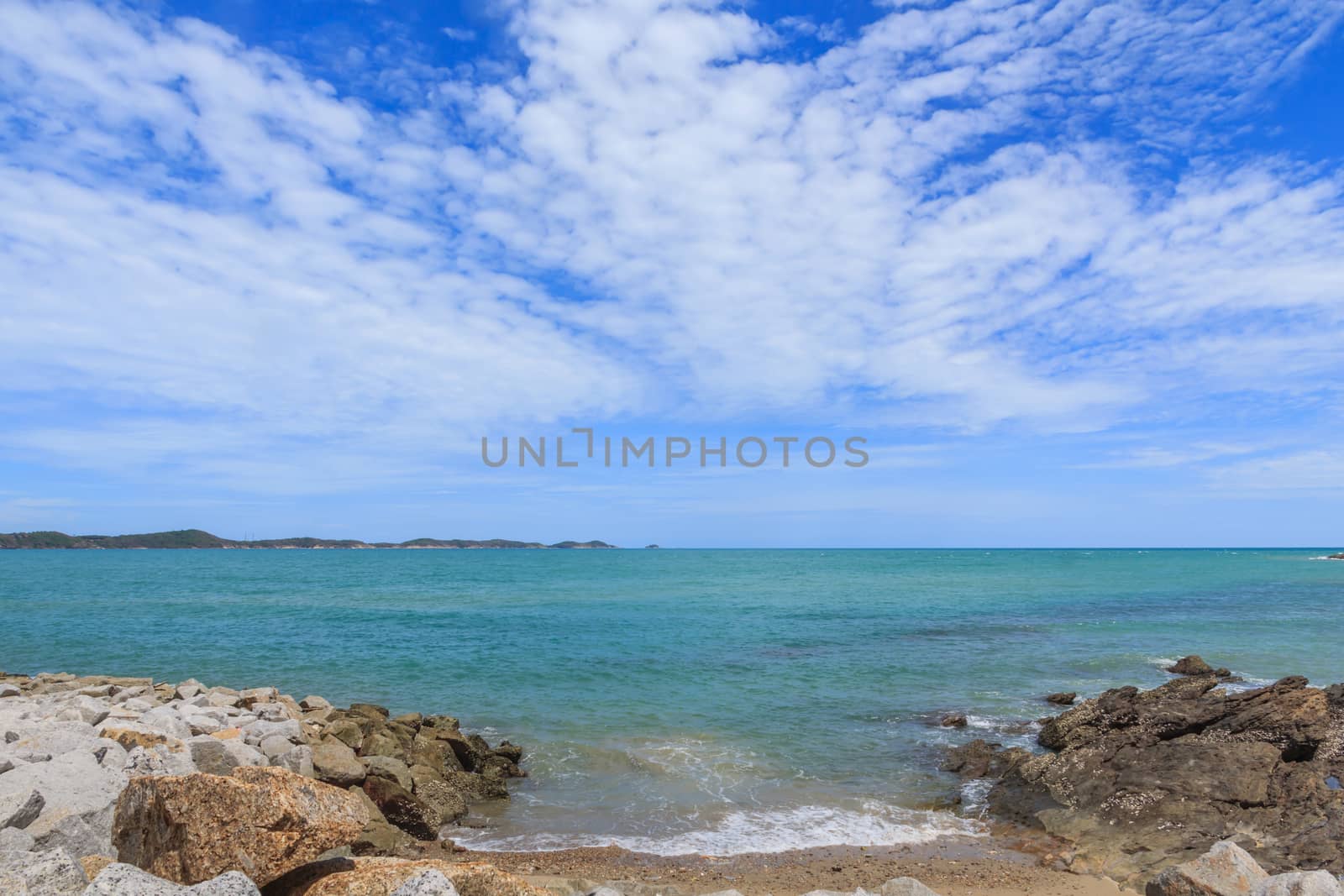 Sky with beautiful beach with rocks and tropical sea in Thailand.