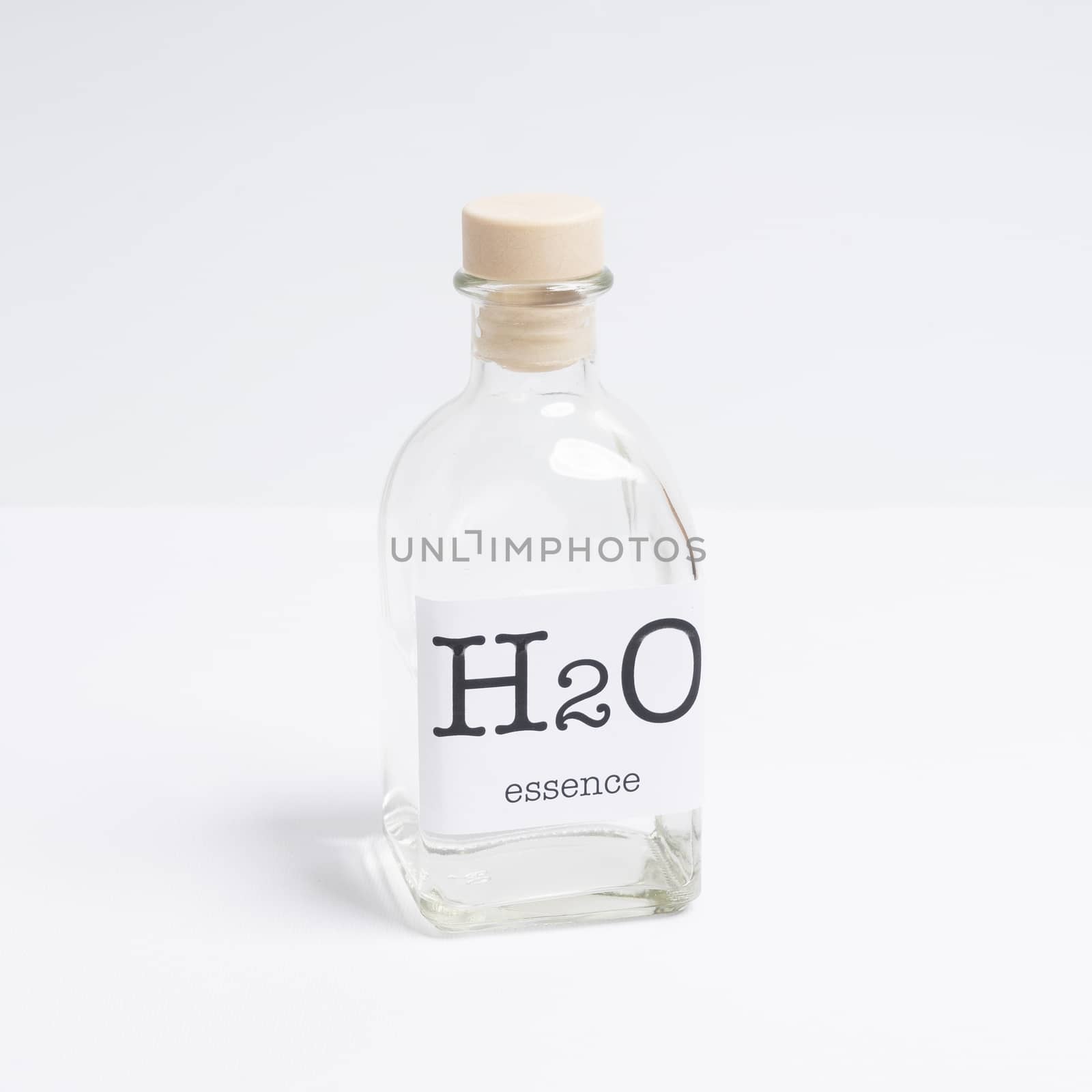a glass bottle containing  H2O essence