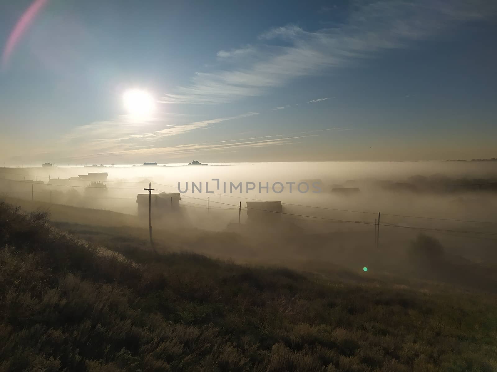 Mystic early Morning village in fog by marynkin