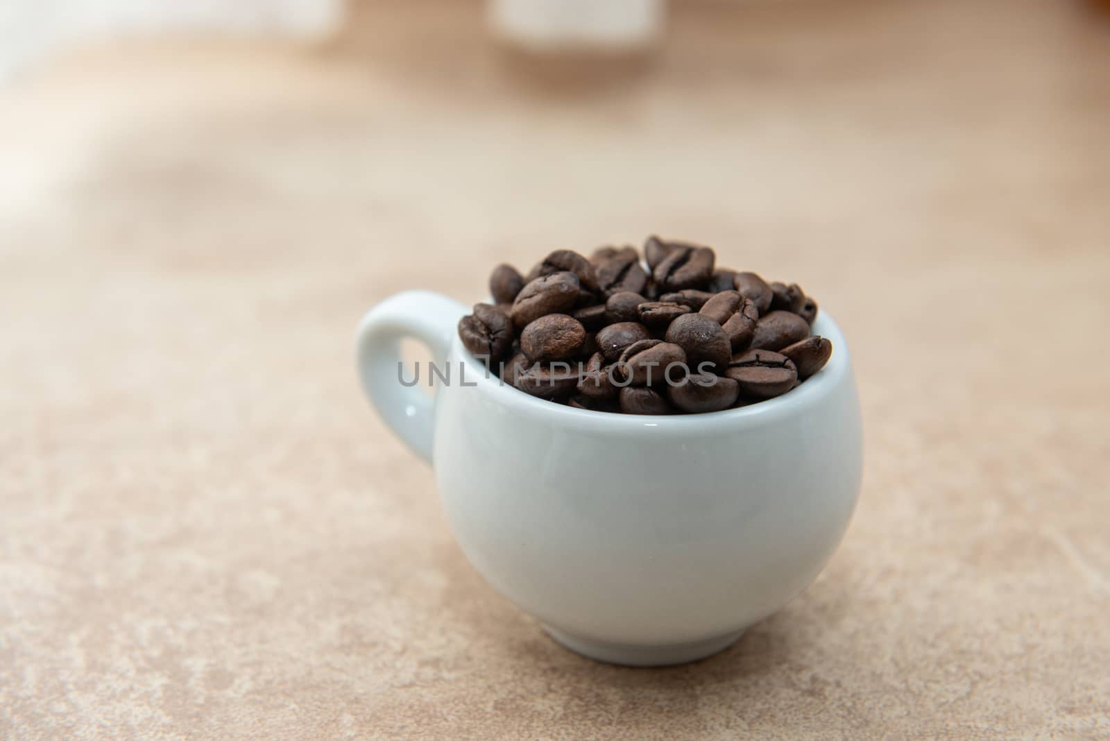 Cup of coffee full of coffee beans by marynkin