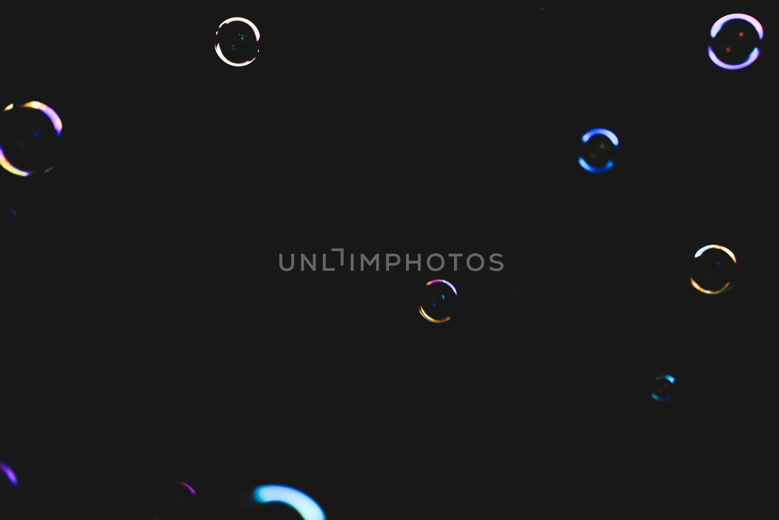 Colorful bubbles over dark background by mikelju