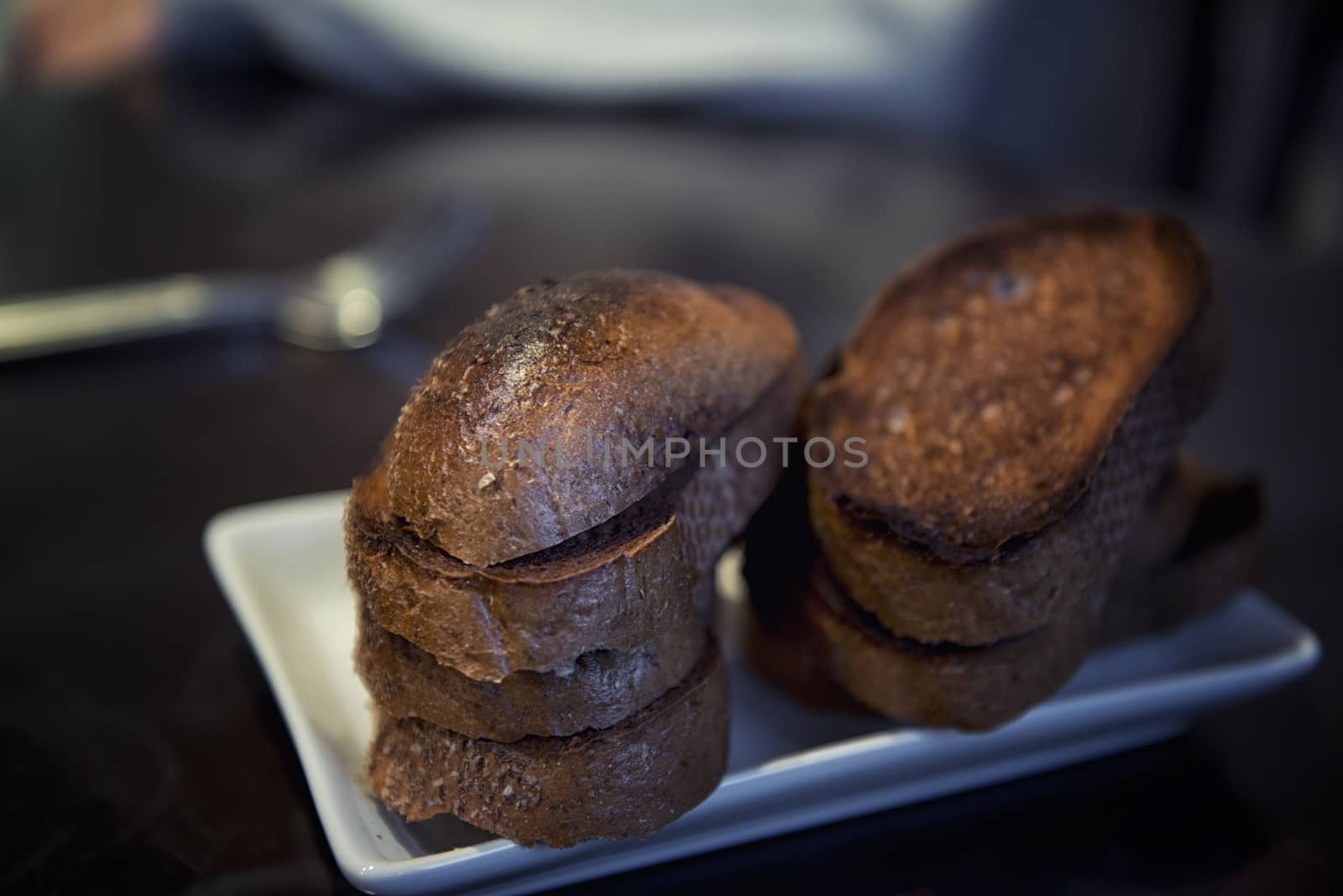 Set of burnt or rye croutons on table