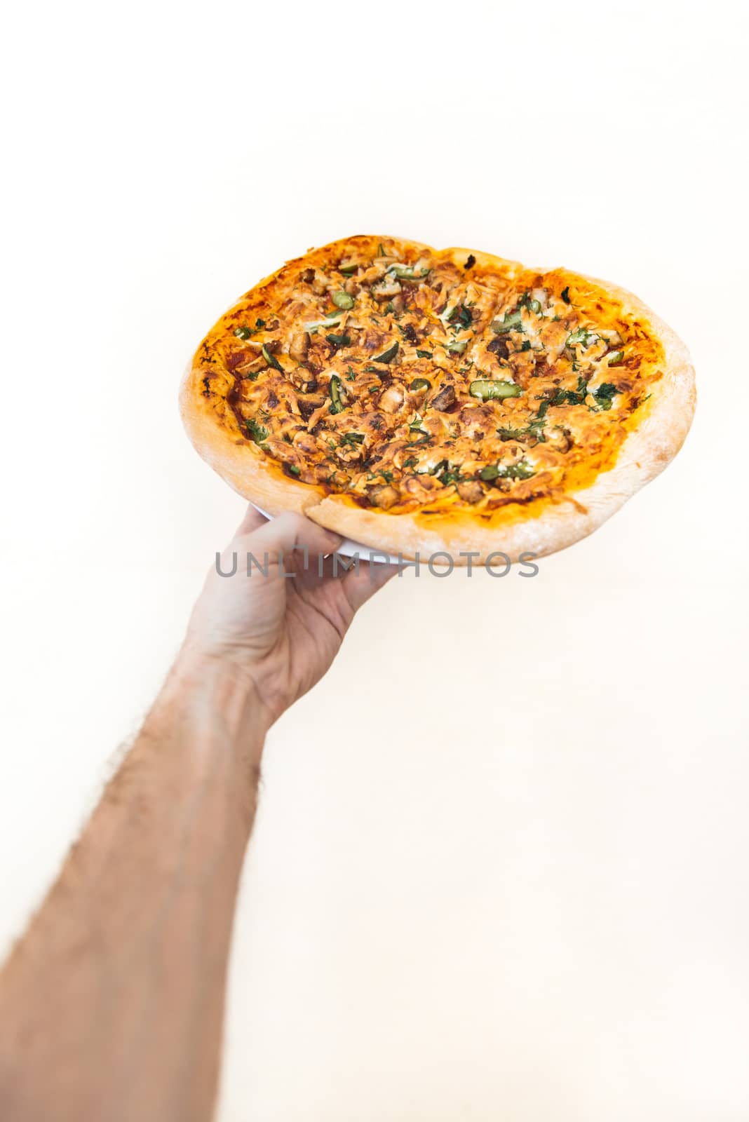 hand hold pizza isolate on white background by marynkin