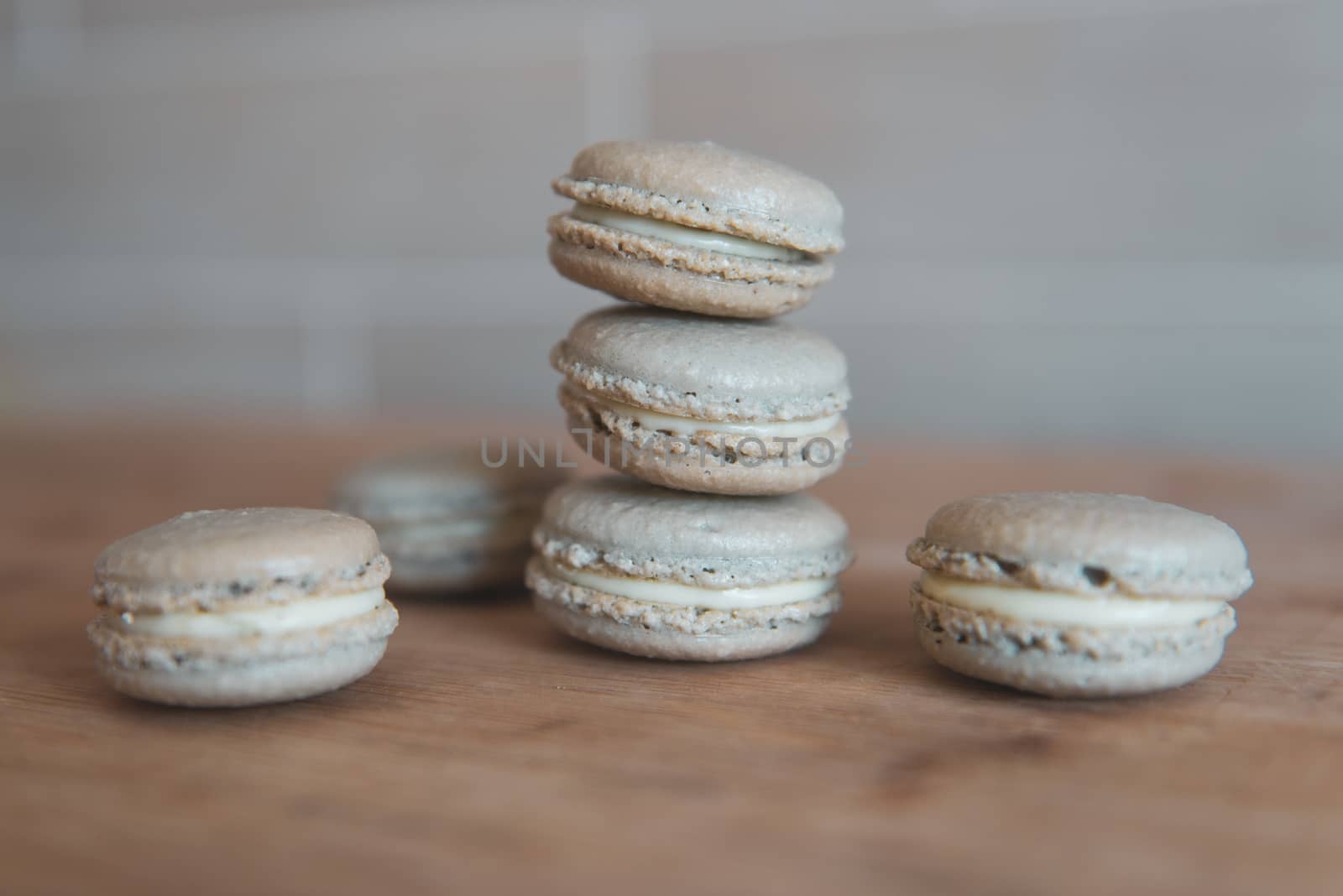 Cake macaron or macaroon on grey background, sweet and colorful dessert by marynkin