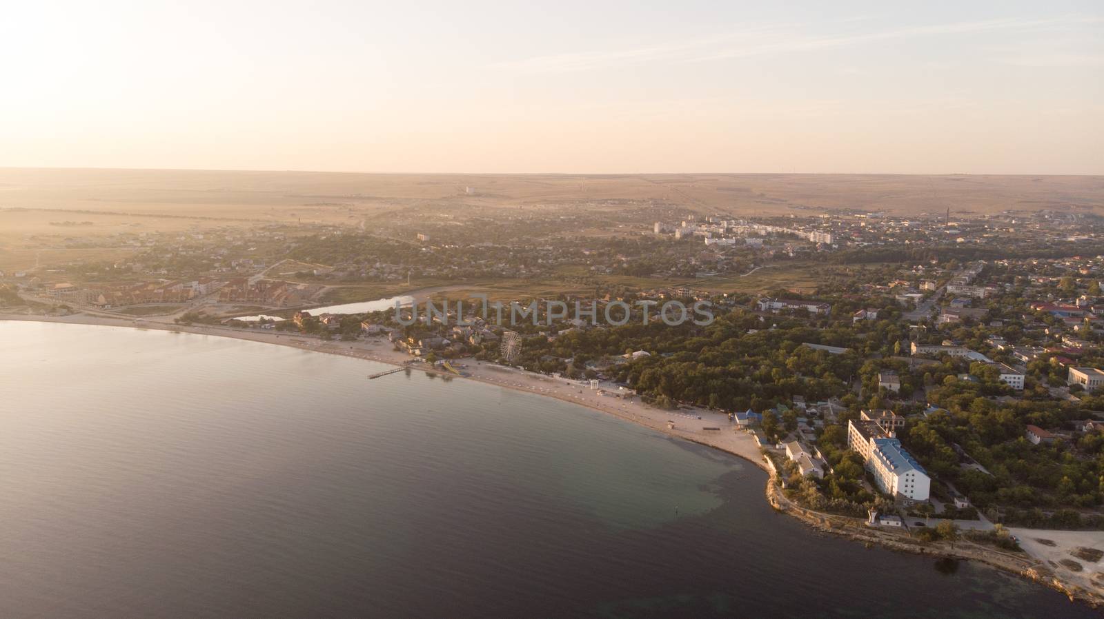 Beautiful aerial view on town near the coast. Sunrise by marynkin