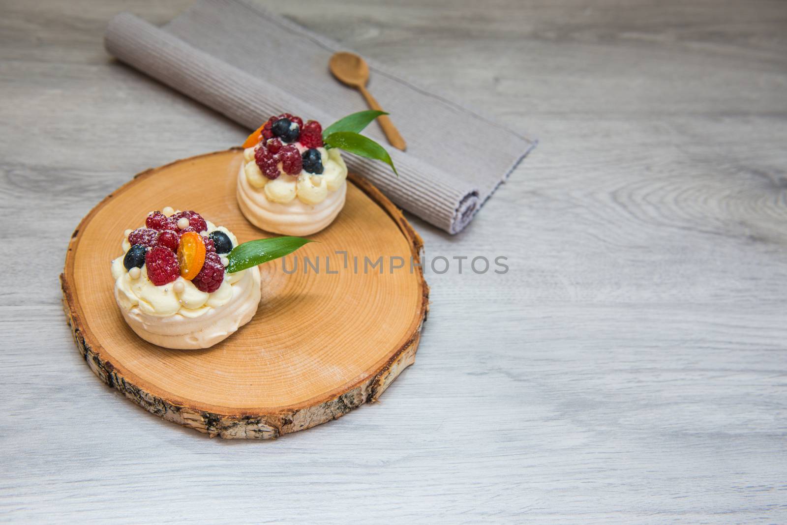 Pavlova meringue cake with cream and small fruits by marynkin