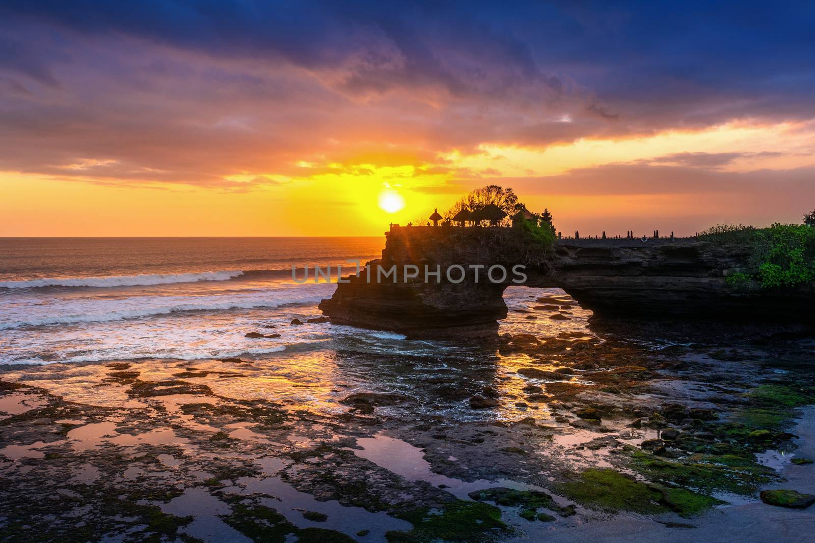 Beautiful sunset at Tanah loh temple in Bali, Indonesia. by gutarphotoghaphy