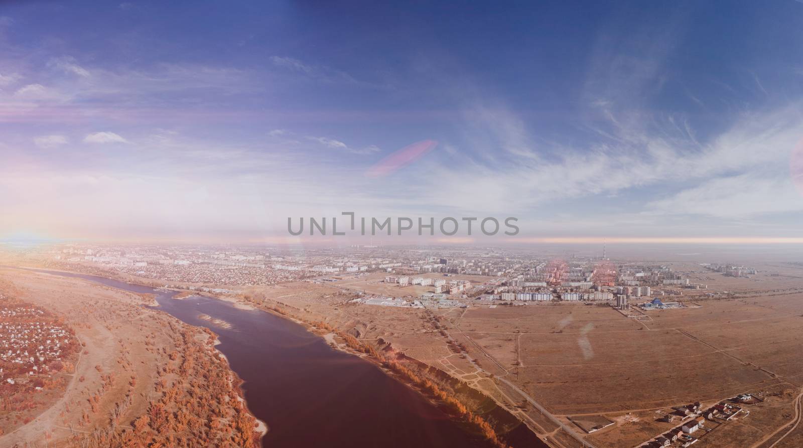 Aerial view on town. Beautiful morning and sunrise. Photo of the village at an altitude of 500 meters.