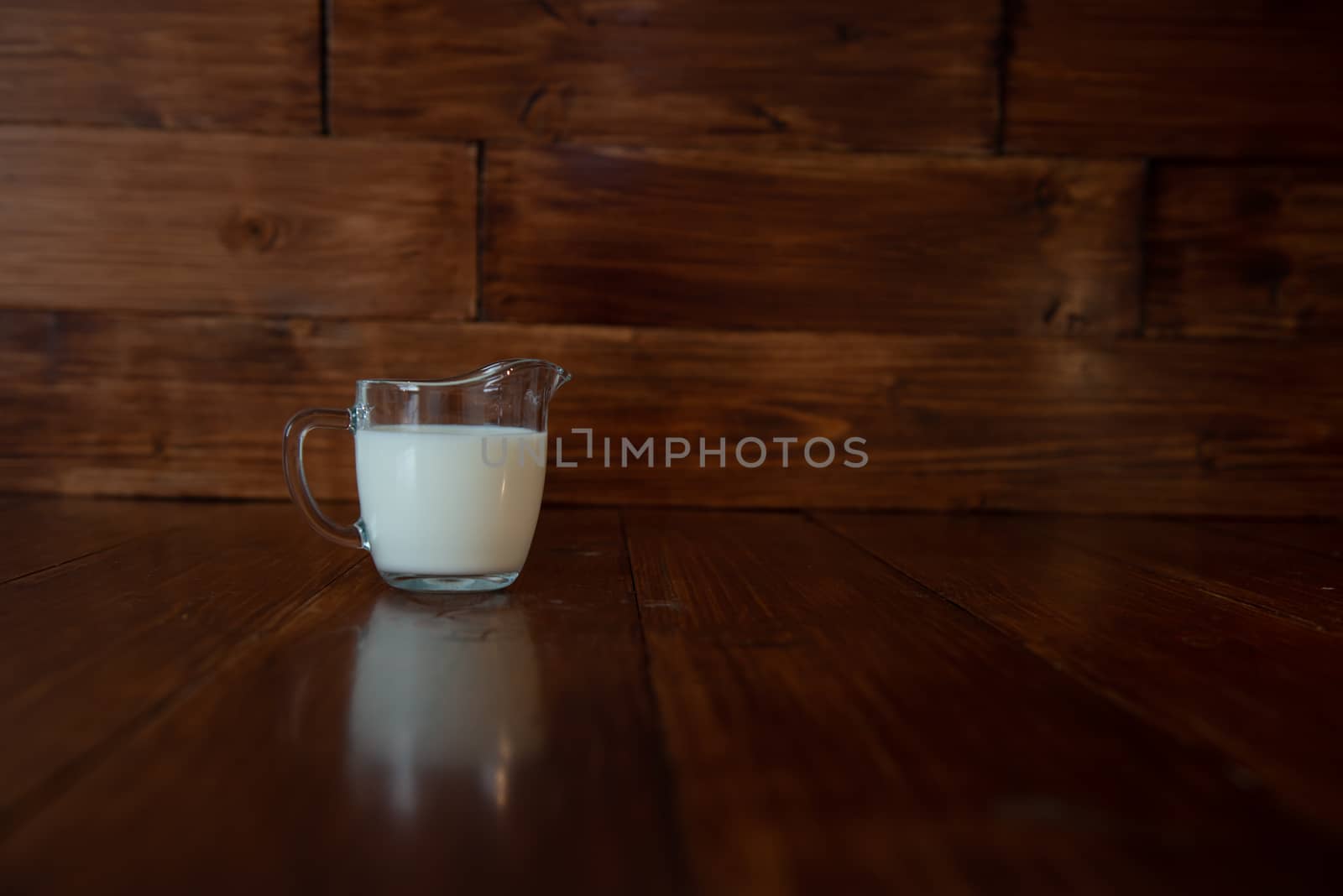 milk in glass milk jug by marynkin