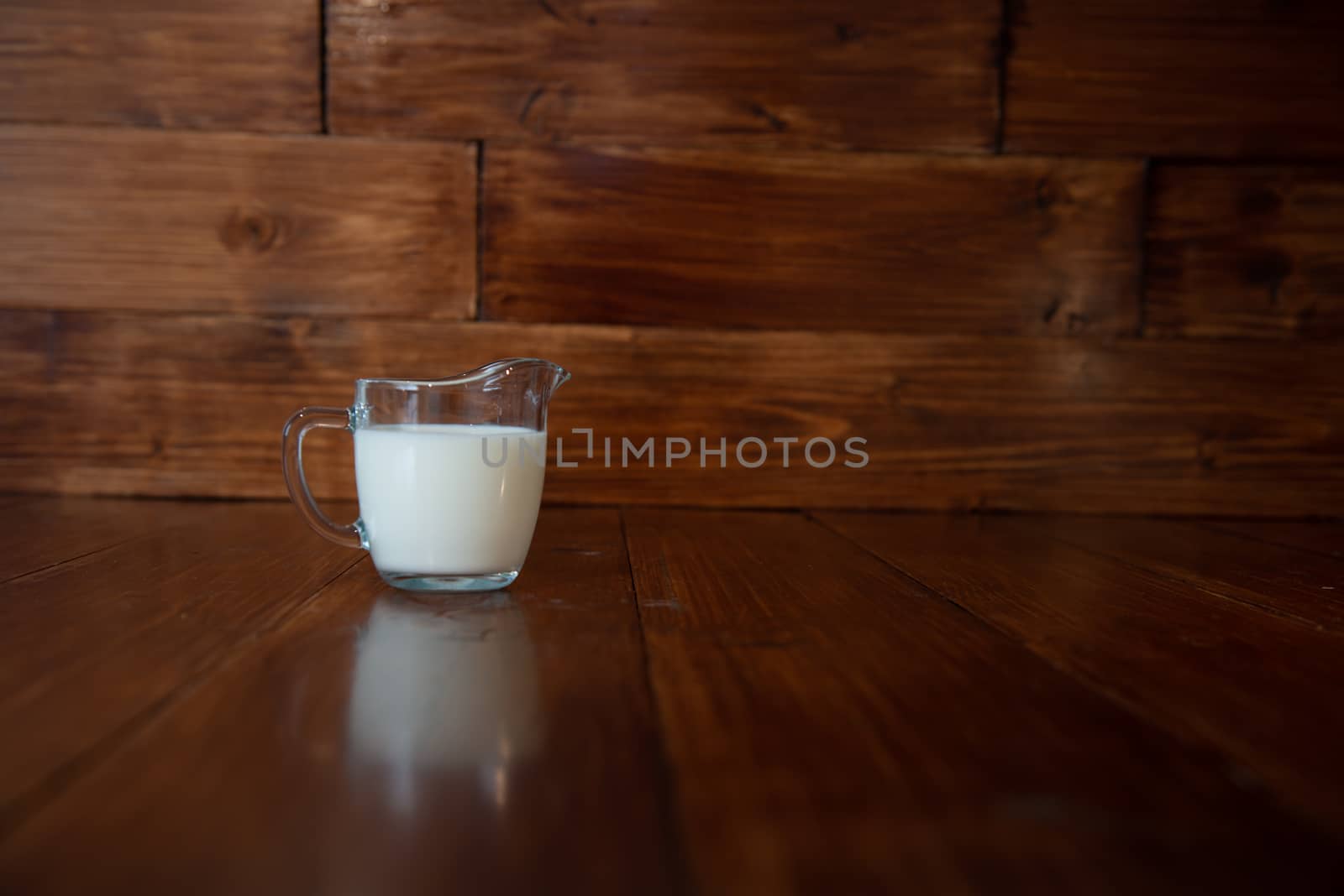 milk in glass milk jug by marynkin